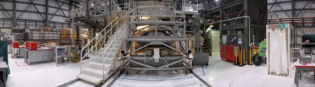 CAPE CANAVERAL, Fla. -- A panoramic view of Orbiter Processing Facility-2 at NASA's Kennedy Space Center in Florida, showing the nose section of space shuttle Endeavour peaking through the scaffolding. As the final planned mission of the Space Shuttle Program, Endeavour and its crew will deliver the Alpha Magnetic Spectrometer, as well as critical spare components to the station on the STS-134 mission targeted for launch Feb. 26, 2011. For more information visit, http://www.nasa.gov/mission_pages/shuttle/shuttlemissions/sts134/index.html. Photo credit: NASA/Frankie Martin