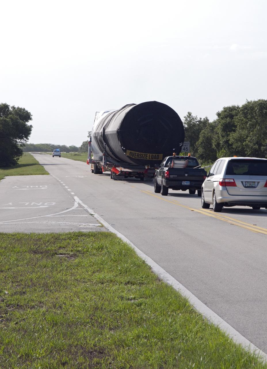 CAPE CANAVERAL, Fla. -- The first stage of the SpaceX Falcon 9 rocket arrives at Cape Canaveral Air Force Station in Florida. Once assembled, it will be a two-stage fully integrated launch vehicle, consisting of a first stage powered by nine SpaceX-developed Merlin 1C engines, a second stage, an interstage, an unpressurized trunk and the Dragon spacecraft qualification unit. SpaceX was awarded procurement for three demonstration flights under the Commercial Orbital Transportation Services, or COTS, program managed by NASA's Johnson Space Center in Houston. A subsequent contract for Commercial Resupply Services, or CRS, was awarded in late 2008 to resupply the International Space Station. The SpaceX CRS contract provides for 12 missions to resupply the station from 2011 through 2015. Photo credit: NASA/Chris Rhodes