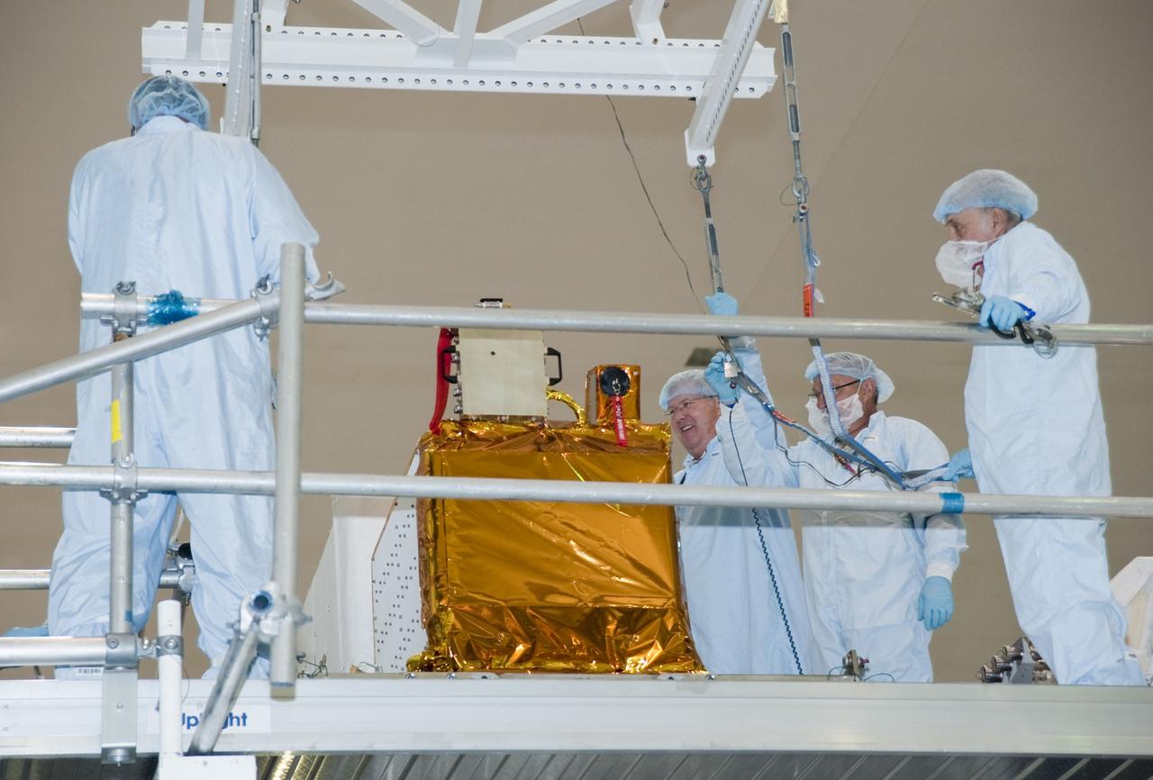CAPE CANAVERAL, Fla. -- In the Space Station Processing Facility at NASA Kennedy Space Center in Florida, the Space Test Program-Houston-3, or STP-H3, is installed onto the Express Logistics Carrier-3, or ELC-3, after the lifting ground support equipment is removed.          STP-H3 is a compliment of four individual Department of Defense experiments that will test concepts in low earth orbit for long duration flights. As the final planned mission of the Space Shuttle Program, shuttle Endeavour and its STS-134 crew will deliver the Alpha Magnetic Spectrometer, the ELC-3 as well as critical spare components to the International Space Station. Endeavour is targeted for launch Feb. 26, 2011. For more information visit, http://www.nasa.gov/mission_pages/shuttle/shuttlemissions/sts134/index.html. Photo credit: NASA/Kim Shiflett