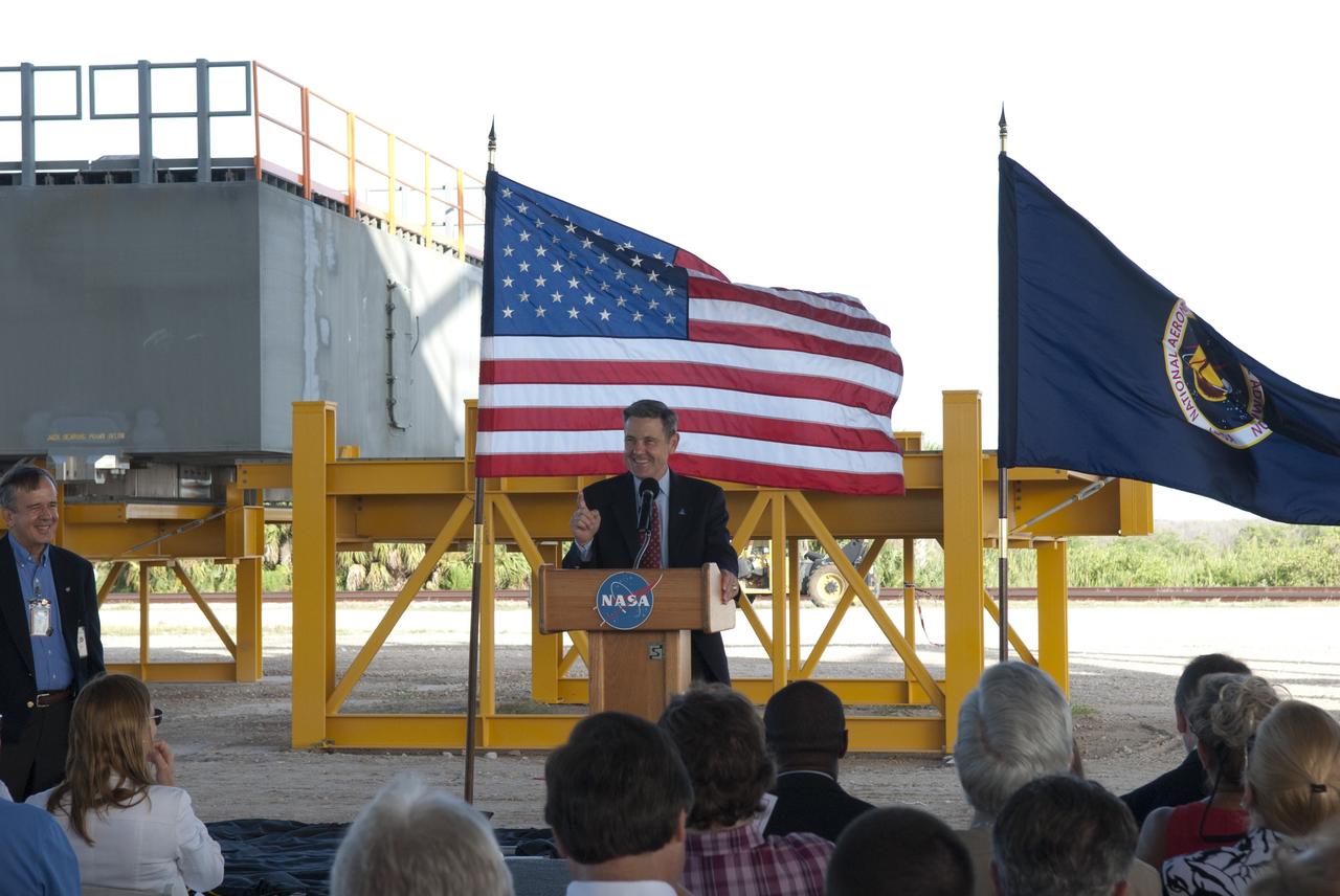 CAPE CANAVERAL, Fla. -- At NASA's Kennedy Space Center in Florida, Kennedy Center Director Bob Cabana talks to employees at a completion ceremony for NASA's new mobile launcher, or ML, support structure. The ceremony was held underneath the structure's launch mount opening. It took about two years to construct the launcher in the Mobile Launcher Park site, north of the Vehicle Assembly Building, or VAB. The 355-foot-tall structure will support NASA's future human spaceflight program. The base of the launcher is lighter than space shuttle mobile launcher platforms so the crawler-transporter can pick up the heavier load of the tower and a taller rocket. The next step will be to add ground support equipment, such as umbilicals and access arms, for future rocket launches. For information on NASA's future plans, visit www.nasa.gov. Photo credit: NASA/Jim Grossmann