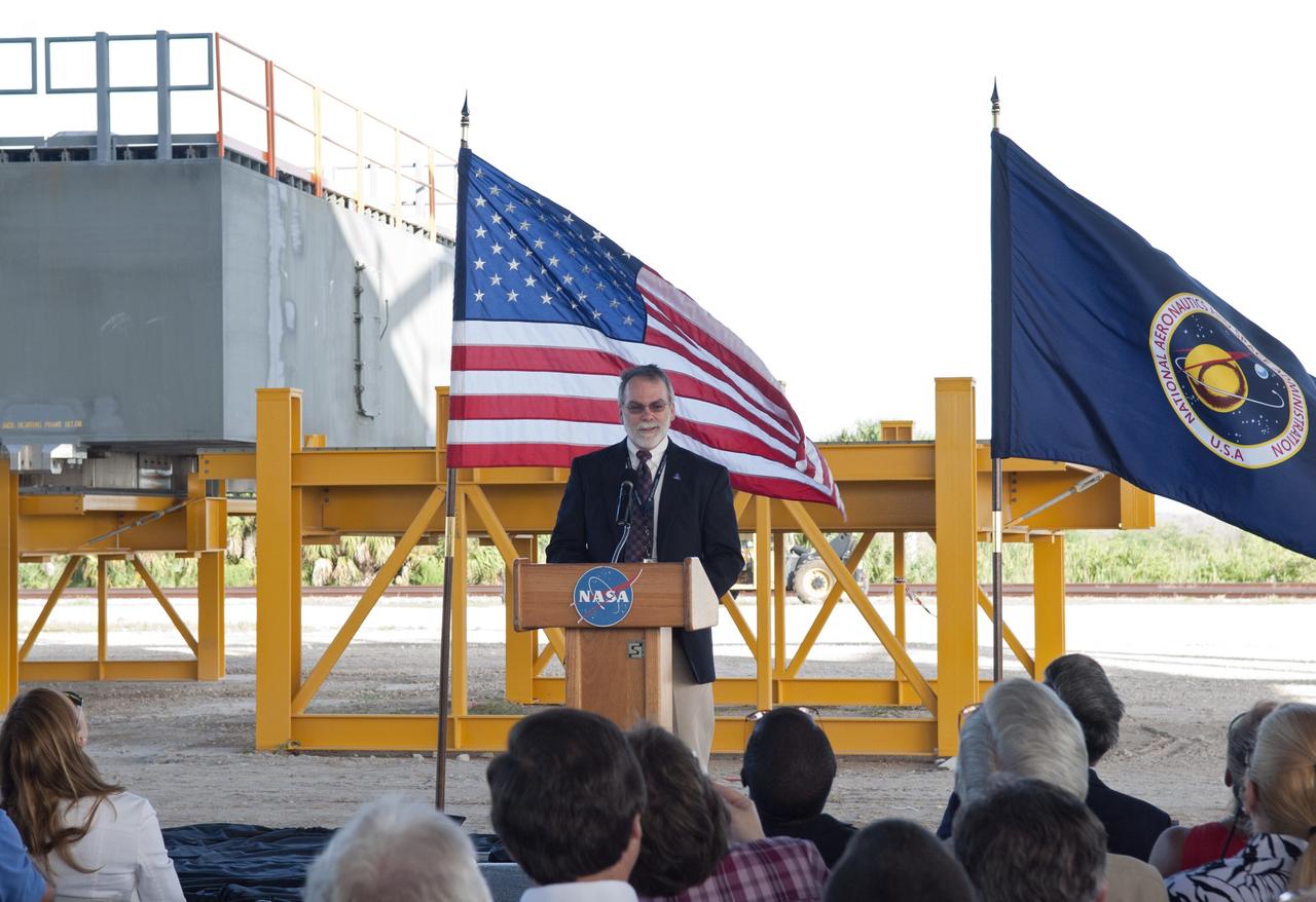 CAPE CANAVERAL, Fla. -- At NASA's Kennedy Space Center in Florida, Constellation Program Manager Dale Thomas talks to employees at a completion ceremony for NASA's new mobile launcher, or ML, support structure. The ceremony was held underneath the structure's launch mount opening. It took about two years to construct the launcher in the Mobile Launcher Park site, north of the Vehicle Assembly Building, or VAB.            The 355-foot-tall structure will support NASA's future human spaceflight program. The base of the launcher is lighter than space shuttle mobile launcher platforms so the crawler-transporter can pick up the heavier load of the tower and a taller rocket. The next step will be to add ground support equipment, such as umbilicals and access arms, for future rocket launches. For information on NASA's future plans, visit www.nasa.gov. Photo credit: NASA/Jim Grossmann