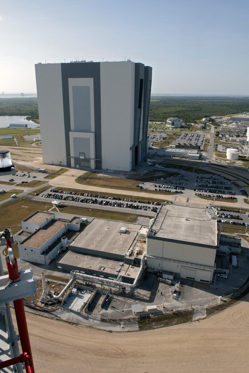 CAPE CANAVERAL, Fla. -- At NASA's Kennedy Space Center in Florida, the 525-foot-tall Vehicle Assembly Building, or VAB, is seen from the tower of NASA's new mobile launcher, or ML, support structure. It took about two years to construct the launcher in the Mobile Launcher Park site, north of the VAB. The 355-foot-tall structure will support NASA's future human spaceflight program. The base of the launcher is lighter than space shuttle mobile launcher platforms so the crawler-transporter can pick up the heavier load of the tower and a taller rocket. The next step will be to add ground support equipment, such as umbilicals and access arms, for future rocket launches. For information on NASA's future plans, visit www.nasa.gov. Photo credit: NASA/Jim Grossmann