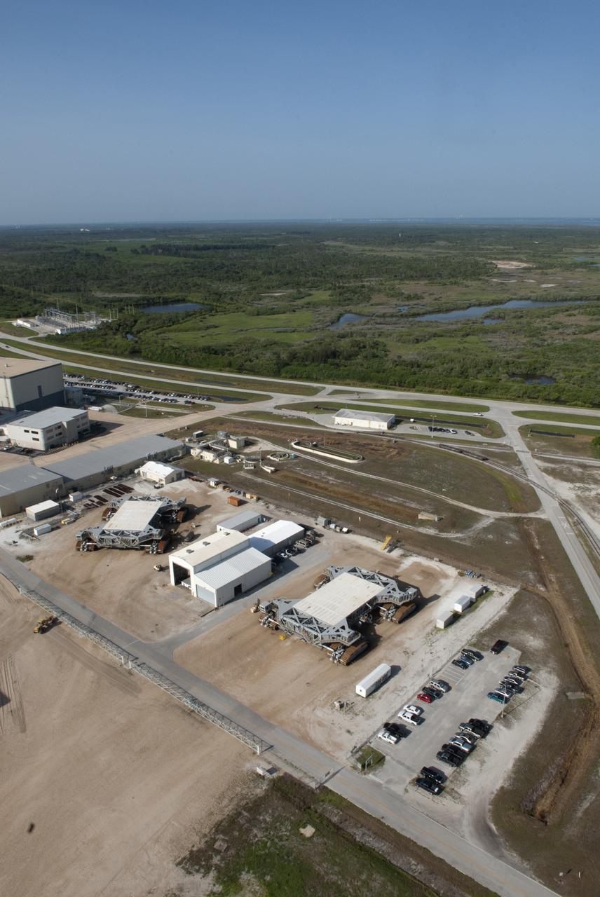 CAPE CANAVERAL, Fla. -- At NASA's Kennedy Space Center in Florida, the crawler-transporters are seen from the tower of NASA's new mobile launcher, or ML, support structure. It took about two years to construct the launcher in the Mobile Launcher Park site, north of the Vehicle Assembly Building, or VAB. The 355-foot-tall structure will support NASA's future human spaceflight program. The base of the launcher is lighter than space shuttle mobile launcher platforms so the crawler-transporter can pick up the heavier load of the tower and a taller rocket. The next step will be to add ground support equipment, such as umbilicals and access arms, for future rocket launches. For information on NASA's future plans, visit www.nasa.gov. Photo credit: NASA/Jim Grossmann
