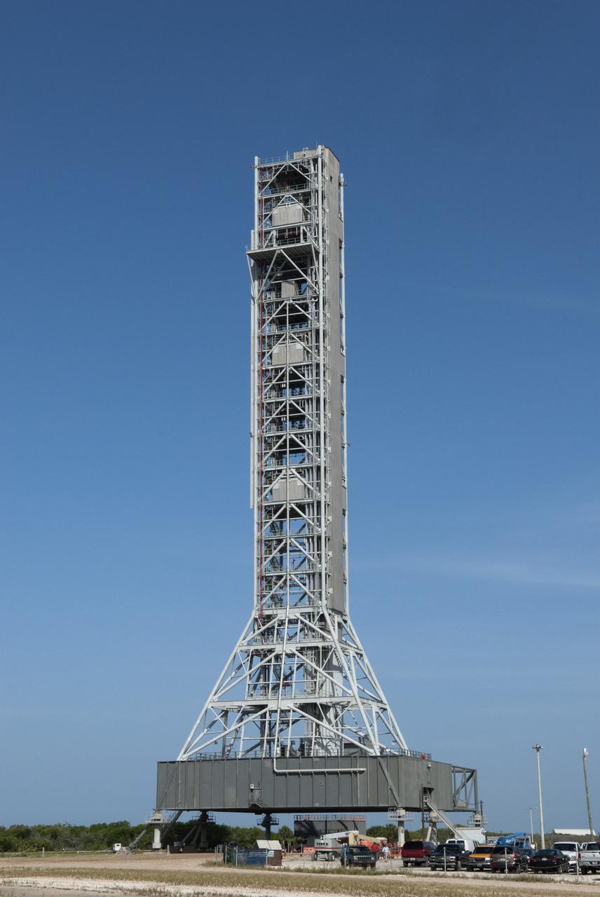 CAPE CANAVERAL, Fla. -- At NASA's Kennedy Space Center in Florida, NASA's new mobile launcher, or ML, support structure, consisting of a base, a tower and a launch mount, is complete. It took about two years to construct the launcher in the Mobile Launcher Park site, north of the Vehicle Assembly Building, or VAB. The 355-foot-tall structure will support NASA's future human spaceflight program. The base of the launcher is lighter than space shuttle mobile launcher platforms so the crawler-transporter can pick up the heavier load of the tower and a taller rocket. The next step will be to add ground support equipment, such as umbilicals and access arms, for future rocket launches. For information on NASA's future plans, visit www.nasa.gov. Photo credit: NASA/Jim Grossmann