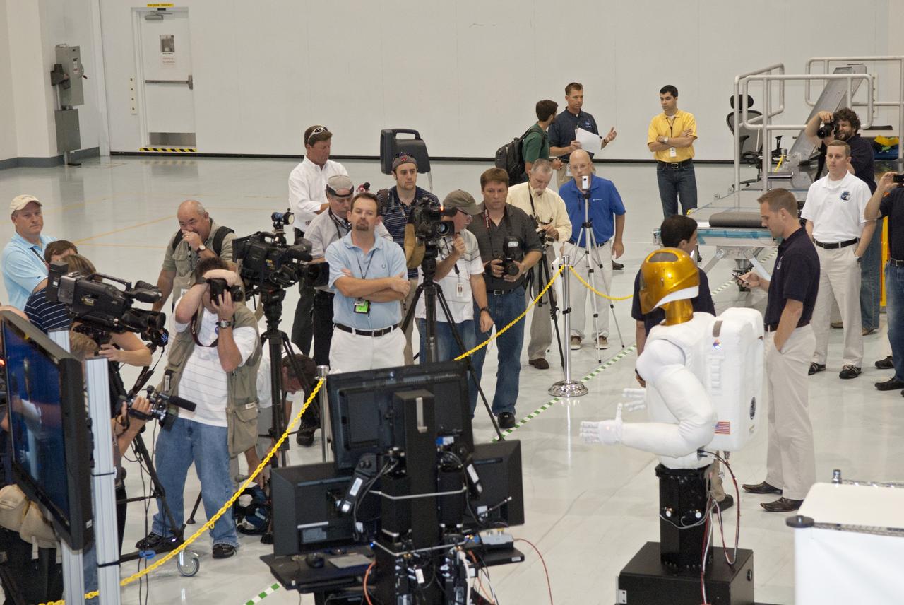 CAPE CANAVERAL, Fla. -- CAPE CANAVERAL, Fla. -- In the Space Station Processing Facility at NASA's Kennedy Space Center in Florida, NASA hosted a media event featuring Robonaut (R2), a dexterous humanoid astronaut helper, to the participants.              R2 will fly to the International Space Station aboard space shuttle Discovery on the STS-133 mission. Although it will initially only participate in operational tests, upgrades could eventually allow the robot to realize its true purpose -- helping spacewalking astronauts with tasks outside the space station. Photo credit: NASA/Jim Grossmann