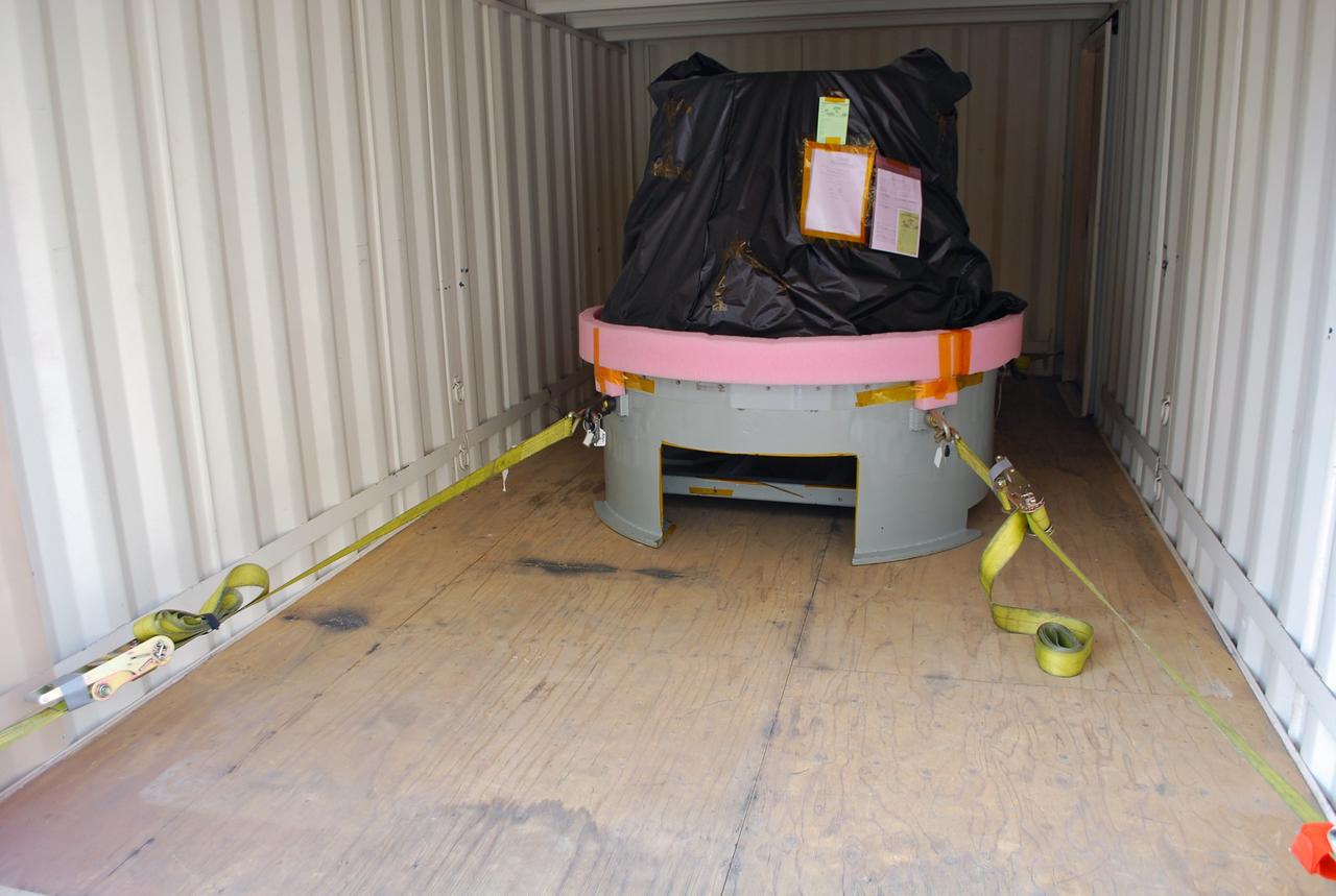 VANDENBERG AIR FORCE BASE, Calif. -- At Vandenberg Air Force Base in California, the payload cone for NASA's Glory mission is pictures secured inside its cargo carrier. The payload cone is an adapter that interfaces the Taurus XL rocket with the spacecraft. A four-stage Taurus XL rocket will carry Glory into low Earth orbit. Once Glory reaches orbit, it will collect data on the properties of aerosols and black carbon. It also will help scientists understand how the sun's irradiance affects Earth's climate. Launch is scheduled for 2:09 a.m. PST Nov. 22. For information, visit www.nasa.gov/glory. Photo credit: NASA/Randy Beaudoin, VAFB