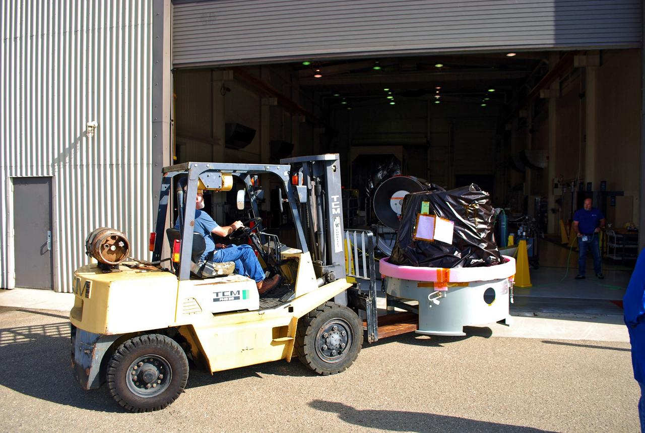 VANDENBERG AIR FORCE BASE, Calif. -- At Vandenberg Air Force Base in California, a worker user a Hyster lift moves the payload cone for NASA's Glory mission into VAFB's payload processing facility. The payload cone is an adapter that interfaces the Taurus XL rocket with the spacecraft. A four-stage Taurus XL rocket will carry Glory into low Earth orbit. Once Glory reaches orbit, it will collect data on the properties of aerosols and black carbon. It also will help scientists understand how the sun's irradiance affects Earth's climate. Launch is scheduled for 2:09 a.m. PST Nov. 22. For information, visit www.nasa.gov/glory. Photo credit: NASA/Randy Beaudoin, VAFB
