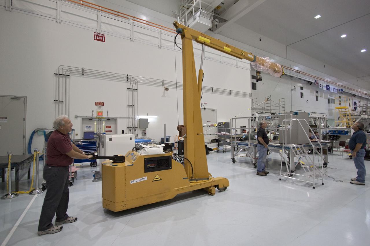 CAPE CANAVERAL, Fla. -- The dexterous humanoid astronaut helper, Robonaut 2, or R2, is ready to be moved to a horizontal position in the Space Station Processing Facility at NASA's Kennedy Space Center in Florida. Packed inside a launch box called SLEEPR, or Structural Launch Enclosure to Effectively Protect Robonaut, R2 will be placed in the Permanent Multipurpose Module, or PMM, in the same launch orientation as space shuttle Discovery's STS-133 crew members -- facing toward the nose of the shuttle with the back taking all the weight.     Although R2 will initially only participate in operational tests, upgrades could eventually allow the robot to realize its true purpose -- helping spacewalking astronauts with tasks outside the International Space Station. STS-133 is targeted to launch Nov. 1.  Photo credit: NASA/Jack Pfaller