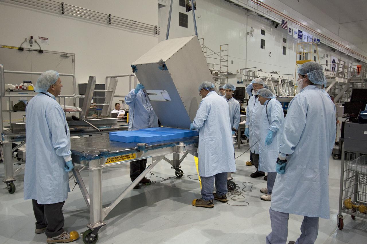 CAPE CANAVERAL, Fla. -- The dexterous humanoid astronaut helper, Robonaut 2, or R2, is moved to a horizontal position in the Space Station Processing Facility at NASA's Kennedy Space Center in Florida. Packed inside a launch box called SLEEPR, or Structural Launch Enclosure to Effectively Protect Robonaut, R2 will be placed in the Permanent Multipurpose Module, or PMM, in the same launch orientation as space shuttle Discovery's STS-133 crew members -- facing toward the nose of the shuttle with the back taking all the weight.     Although R2 will initially only participate in operational tests, upgrades could eventually allow the robot to realize its true purpose -- helping spacewalking astronauts with tasks outside the International Space Station. STS-133 is targeted to launch Nov. 1.  Photo credit: NASA/Jack Pfaller
