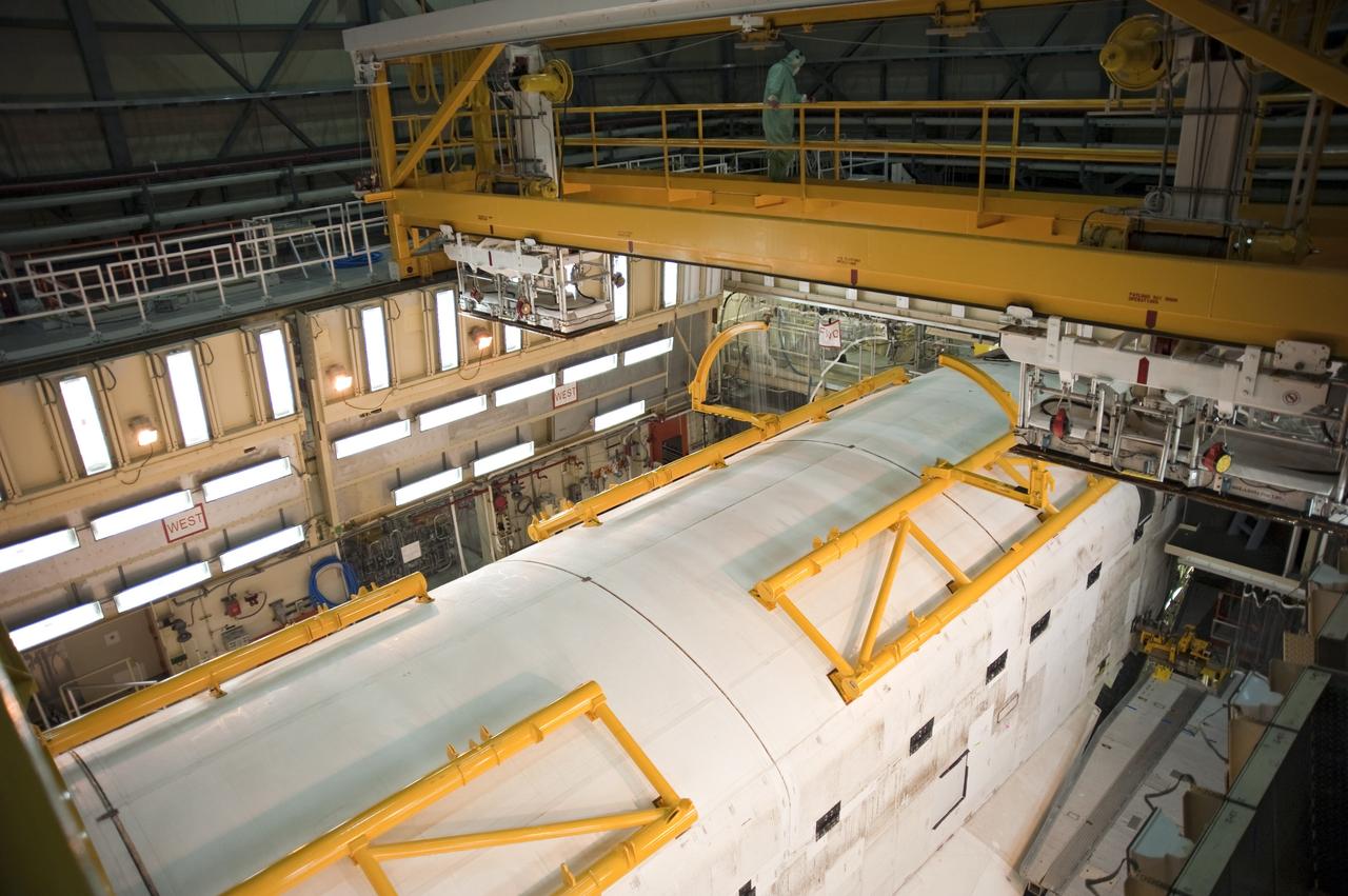CAPE CANAVERAL, Fla. -- In Orbiter Processing Facility-3 at NASA's Kennedy Space Center in Florida, the clamshell doors of space shuttle Discovery's payload bay are closed completely in preparation for the its move to the Vehicle Assembly Building next month. There, it will be attached to its external fuel tank and a set of solid rocket boosters for launch on the STS-133 mission to the International Space Station.    Targeted to launch Nov. 1, STS-133 will carry the multipurpose logistics module, or PMM, packed with supplies and critical spare parts, as well as Robonaut 2, or R2, to the station. Discovery will leave the module behind so it can be used for microgravity experiments in fluid physics, materials science, biology and biotechnology. Photo credit: NASA/Kim Shiflett