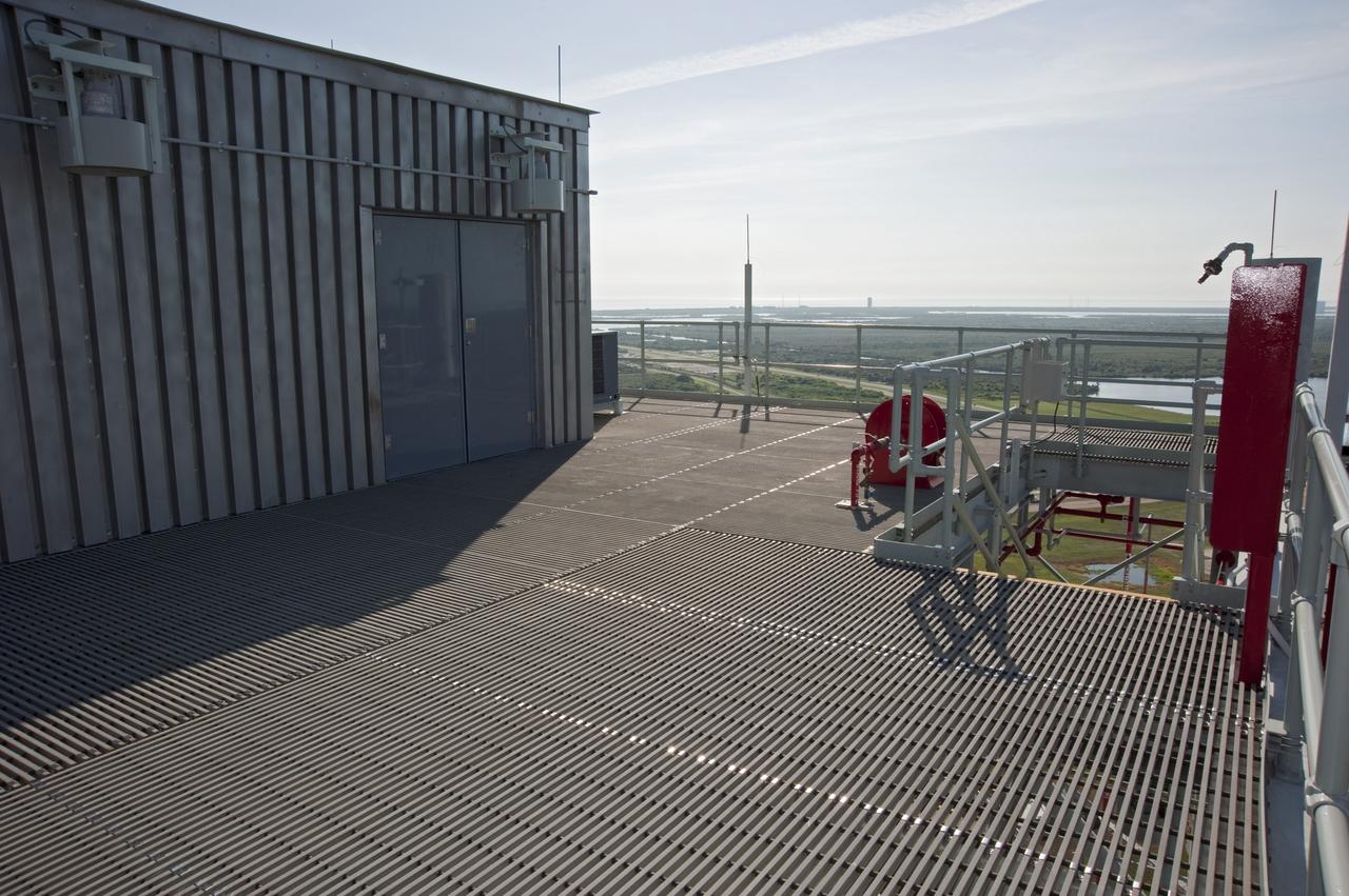 CAPE CANAVERAL, Fla. -- At NASA's Kennedy Space Center in Florida, the Cape Canaveral National Seashore is seen from the tower of NASA's new mobile launcher, or ML, support structure. It took about two years to construct the launcher in the Mobile Launcher Park site, north of the Vehicle Assembly Building, or VAB. The 355-foot-tall structure will support NASA's future human spaceflight program. The base of the launcher is lighter than space shuttle mobile launcher platforms so the crawler-transporter can pick up the heavier load of the tower and a taller rocket. The next step will be to add ground support equipment, such as umbilicals and access arms, for future rocket launches. For information on NASA's future plans, visit www.nasa.gov. Photo credit: NASA/Kim Shiflett
