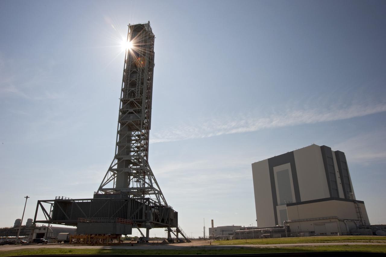 CAPE CANAVERAL, Fla. -- At NASA's Kennedy Space Center in Florida, NASA's new mobile launcher, or ML, support structure stands next to the 525-foot-tall Vehicle Assembly Building, or VAB. It took about two years to construct the launcher in the Mobile Launcher Park site, north of the VAB. The 355-foot-tall structure will support NASA's future human spaceflight program. The base of the launcher is lighter than space shuttle mobile launcher platforms so the crawler-transporter can pick up the heavier load of the tower and a taller rocket. The next step will be to add ground support equipment, such as umbilicals and access arms, for future rocket launches. For information on NASA's future plans, visit www.nasa.gov. Photo credit: NASA/Kim Shiflett