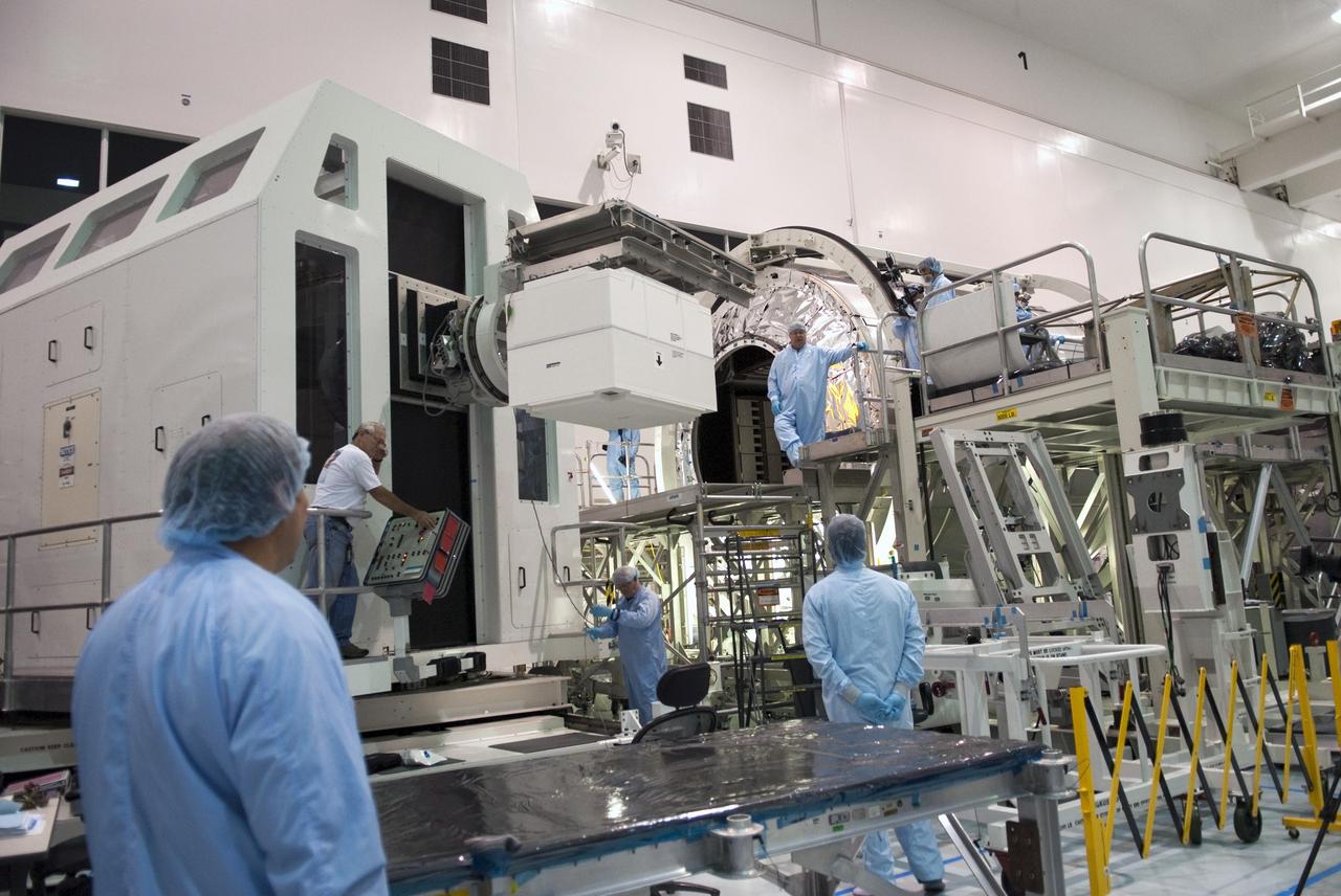 CAPE CANAVERAL, Fla. -- Technicians in the Space Station Processing Facility at NASA's Kennedy Space Center in Florida prepare to load the dexterous humanoid astronaut helper, Robonaut 2, or R2, into the Permanent Multipurpose Module, or PMM. Packed inside a launch box called SLEEPR, or Structural Launch Enclosure to Effectively Protect Robonaut, R2 will be placed in the in the same launch orientation as space shuttle Discovery's STS-133 crew members -- facing toward the nose of the shuttle with the back taking all the weight.              Although R2 will initially only participate in operational tests, upgrades could eventually allow the robot to realize its true purpose -- helping spacewalking astronauts with tasks outside the International Space Station. STS-133 is targeted to launch Nov. 1.  Photo credit: NASA/Frankie Martin