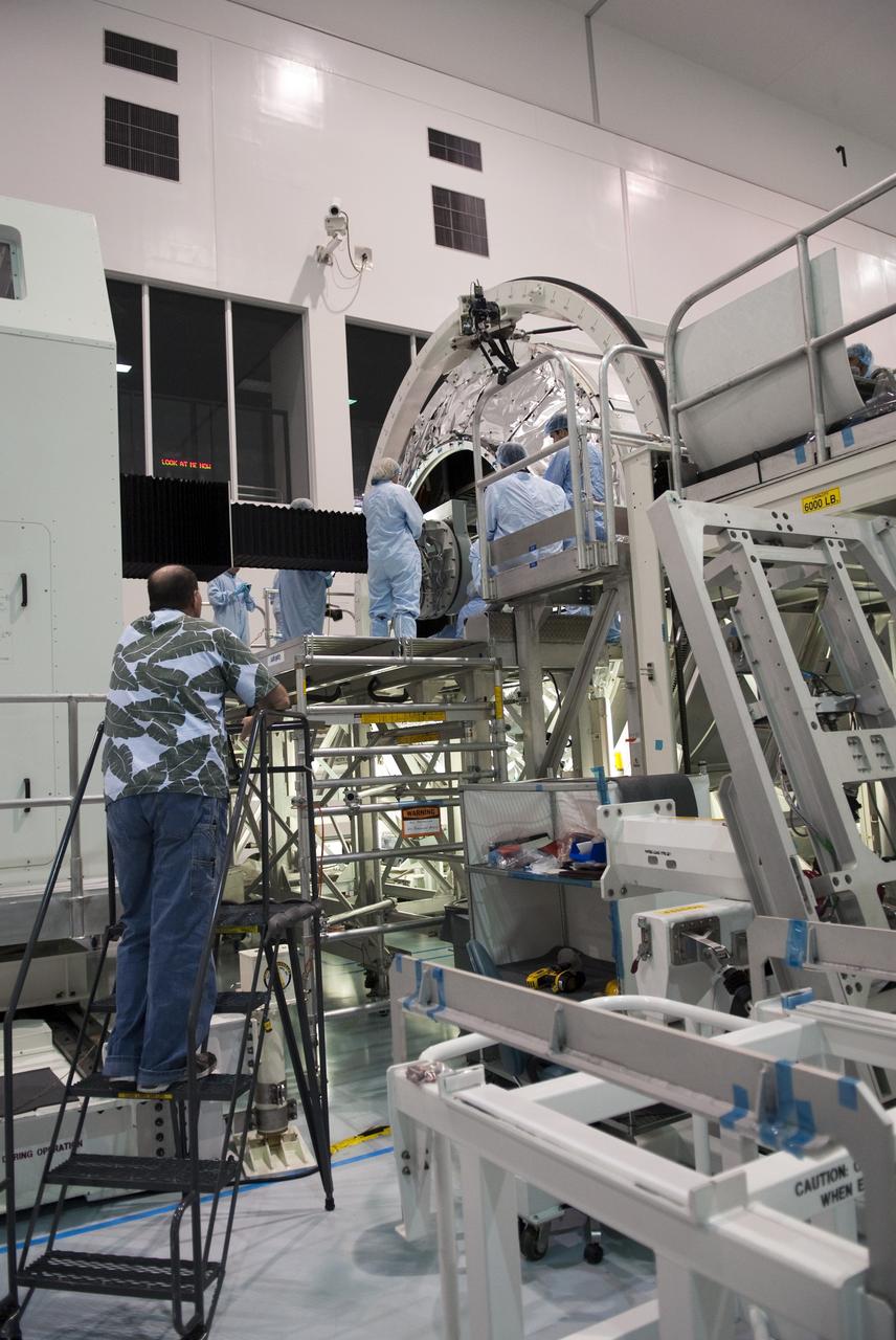 CAPE CANAVERAL, Fla. -- Technicians in the Space Station Processing Facility at NASA's Kennedy Space Center in Florida load the dexterous humanoid astronaut helper, Robonaut 2, or R2, into the Permanent Multipurpose Module, or PMM. Packed inside a launch box called SLEEPR, or Structural Launch Enclosure to Effectively Protect Robonaut, R2 will be placed in the in the same launch orientation as space shuttle Discovery's STS-133 crew members -- facing toward the nose of the shuttle with the back taking all the weight.                Although R2 will initially only participate in operational tests, upgrades could eventually allow the robot to realize its true purpose -- helping spacewalking astronauts with tasks outside the International Space Station. STS-133 is targeted to launch Nov. 1.  Photo credit: NASA/Frankie Martin