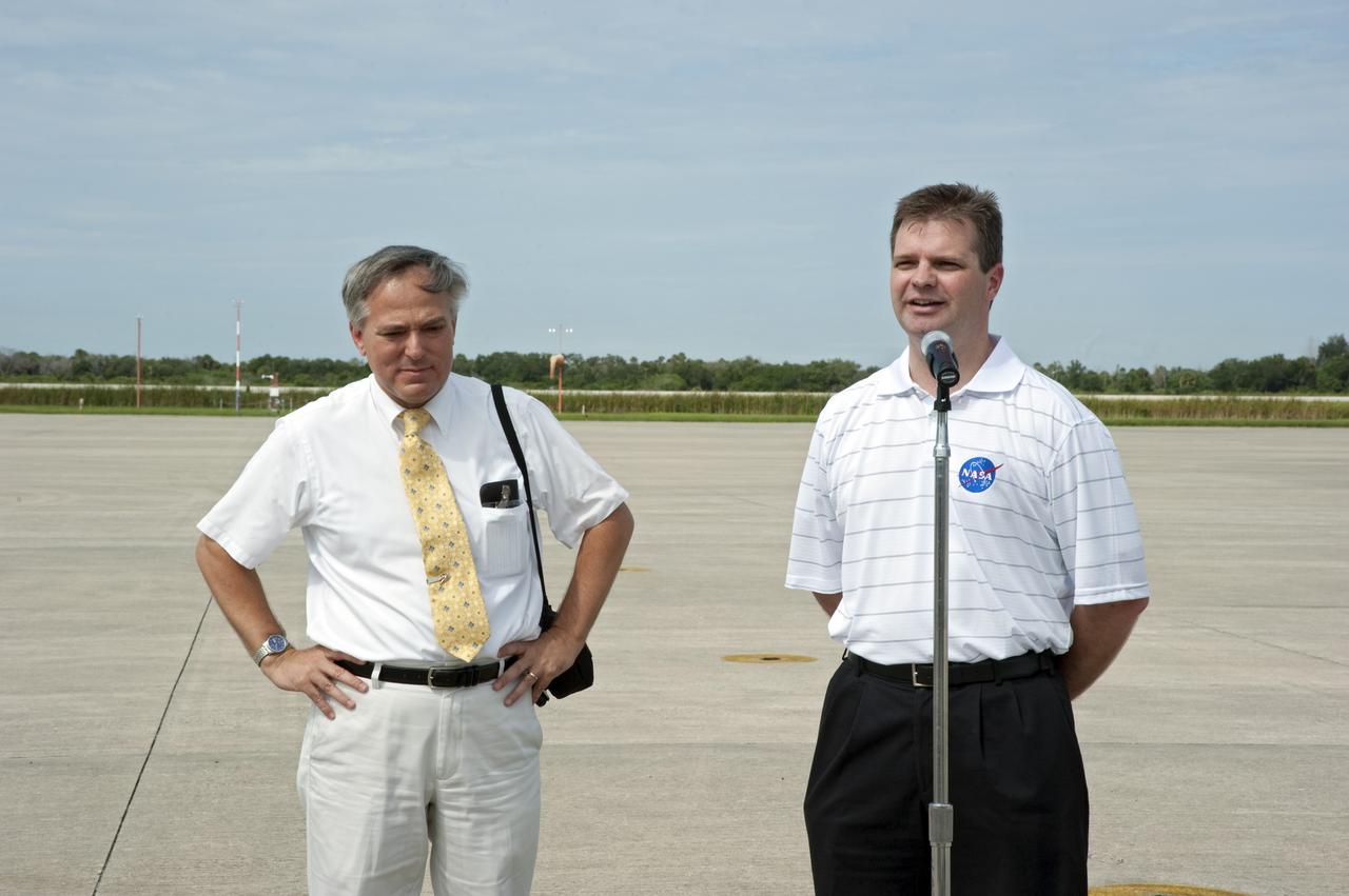 CAPE CANAVERAL, Fla. -- Mark Sistilli, AMS Program Manager from NASA Headquarters looks on as Trent Martin, AMS Project Manager from NASA's Johnson Space Center in Houston speaks to the media prior to the arrival of the Alpha Magnetic Spectrometer, or AMS, to the Shuttle Landing Facility at NASA's Kennedy Space Center in Florida.                AMS, a state-of-the-art particle physics detector, is designed to operate as an external module on the International Space Station. It will use the unique environment of space to study the universe and its origin by searching for dark matter. The STS-134 crew will fly AMS to the International Space Station aboard space shuttle Endeavour,   targeted to launch Feb. 26, 2011. Photo credit: NASA/Kim Shiflett