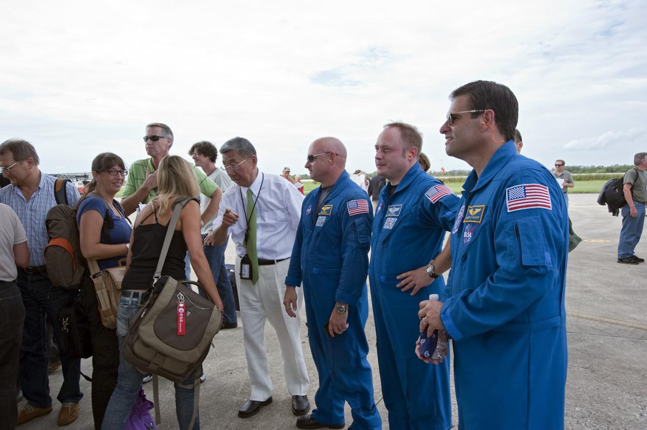 CAPE CANAVERAL, Fla. -- After the arrival of the Alpha Magnetic Spectrometer, or AMS, at the Shuttle Landing Facility at NASA's Kennedy Space Center in Florida, Professor Sam Ting, AMS Principal Investigator from the Massachusetts Institute of Technology speaks with the media while STS-134 Commander Mark Kelly, Mission Specialists Michael Fincke and Greg Chamitoff look on.        AMS,a state-of-the-art particle physics detector, is designed to operate as an external module on the International Space Station. It will use the unique environment of space to study the universe and its origin by searching for dark matter. AMS will fly to the International Space Station aboard space shuttle Endeavour's STS-134 mission targeted to launch Feb. 26, 2011. Photo credit: NASA/Kim Shiflett