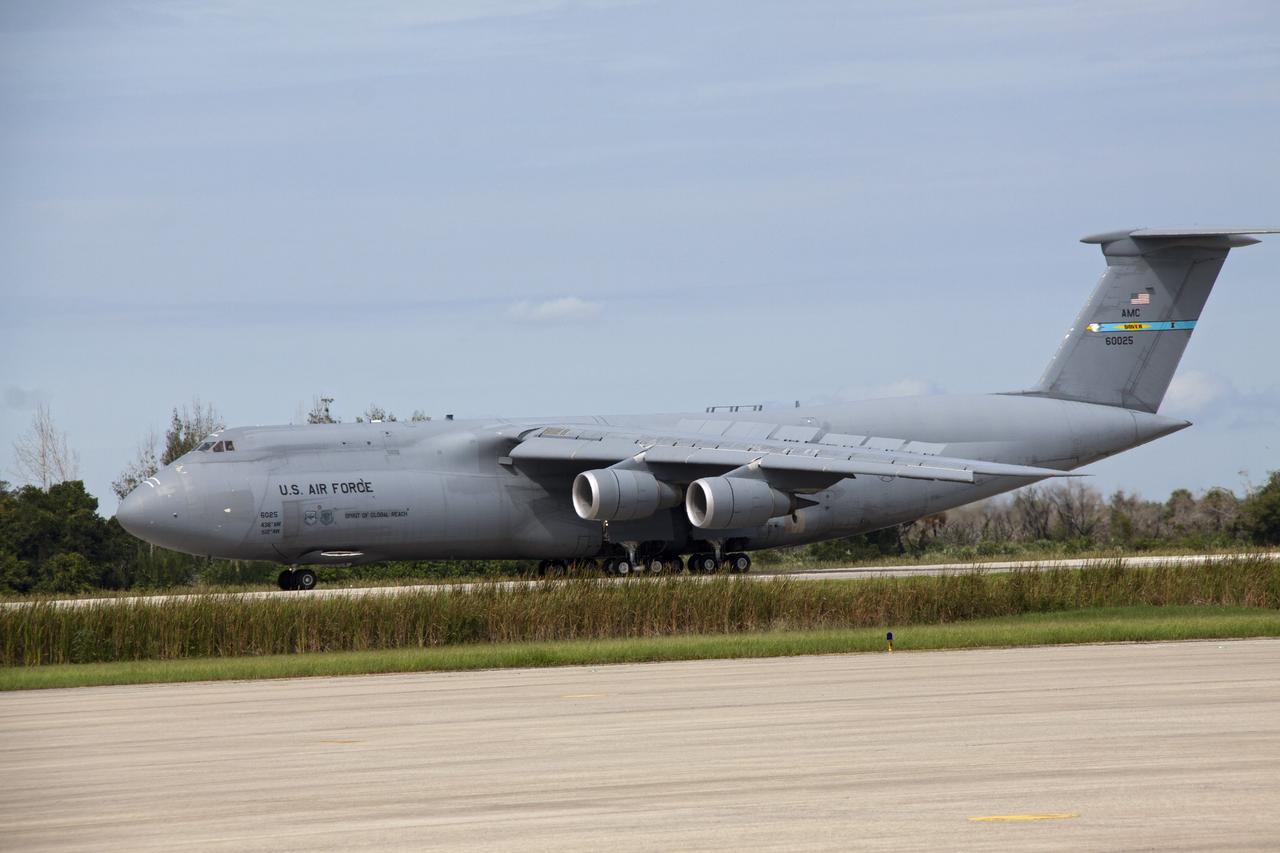 CAPE CANAVERAL, Fla. -- At NASA's Kennedy Space Center in Florida, the Alpha Magnetic Spectrometer, or AMS, arrives on the Shuttle Landing Facility runway aboard an Air Force C-5M aircraft from Europe. The state-of-the-art particle physics detector is designed to operate as an external module on the International Space Station. It will use the unique environment of space to study the universe and its origin by searching for dark matter. AMS will fly to the International Space Station aboard space shuttle Endeavour's STS-134 mission targeted to launch Feb. 26, 2011. Photo credit: NASA/Jack Pfaller