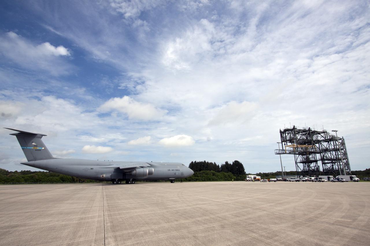 CAPE CANAVERAL, Fla. -- At NASA's Kennedy Space Center in Florida, the Alpha Magnetic Spectrometer, or AMS, arrives on the Shuttle Landing Facility runway aboard an Air Force C-5M aircraft from Europe. The state-of-the-art particle physics detector is designed to operate as an external module on the International Space Station. It will use the unique environment of space to study the universe and its origin by searching for dark matter. AMS will fly to the International Space Station aboard space shuttle Endeavour's STS-134 mission targeted to launch Feb. 26, 2011. Photo credit: NASA/Jack Pfaller