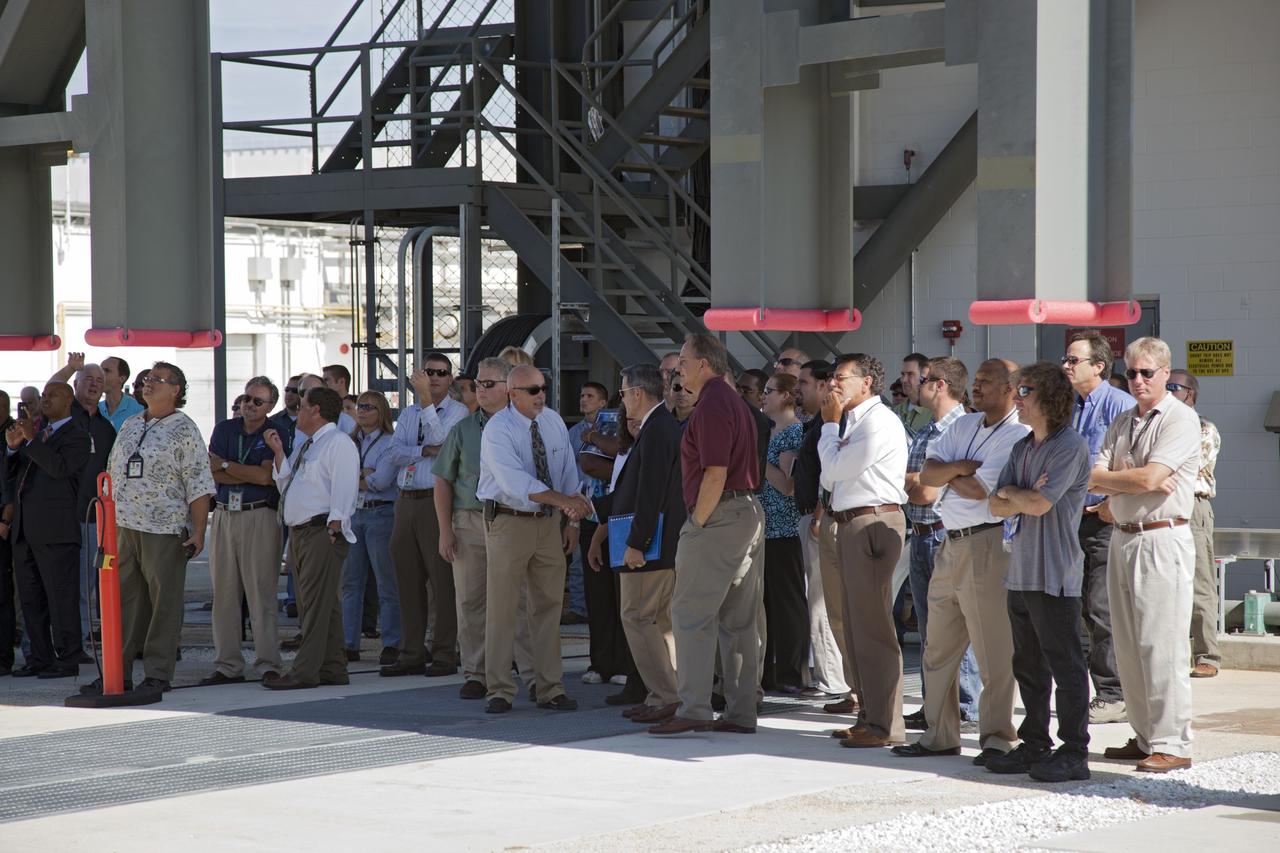 CAPE CANAVERAL, Fla. -- At NASA's Kennedy Space Center in Florida, workers watch the vehicle motion simulator, or VMS, simulate all of the movements a space vehicle could experience from rollout to launch. The VMS is part of the Launch Equipment Test Facility's (LETF) $35 million comprehensive upgrade that lasted four years.           The LETF was established in the 1970s to support the qualification of the Space Shuttle Program’s umbilical and T-0 mechanisms. Throughout the years, it has supported the development of systems for shuttle and the International Space Station, Delta and Atlas rockets, and various research and development programs. The LETF has unique capabilities to evolve into a versatile test and development area that supports a wide spectrum of programs. For information on NASA's future plans, visit www.nasa.gov. Photo credit: NASA/Dimitri Gerondidakis