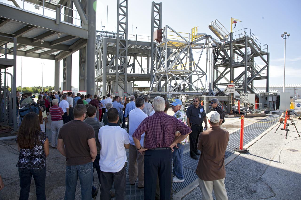 CAPE CANAVERAL, Fla. -- At NASA's Kennedy Space Center in Florida, workers watch the vehicle motion simulator, or VMS, simulate all of the movements a space vehicle could experience from rollout to launch. The VMS is part of the Launch Equipment Test Facility's (LETF) $35 million comprehensive upgrade that lasted four years.            The LETF was established in the 1970s to support the qualification of the Space Shuttle Program’s umbilical and T-0 mechanisms. Throughout the years, it has supported the development of systems for shuttle and the International Space Station, Delta and Atlas rockets, and various research and development programs. The LETF has unique capabilities to evolve into a versatile test and development area that supports a wide spectrum of programs. For information on NASA's future plans, visit www.nasa.gov. Photo credit: NASA/Dimitri Gerondidakis