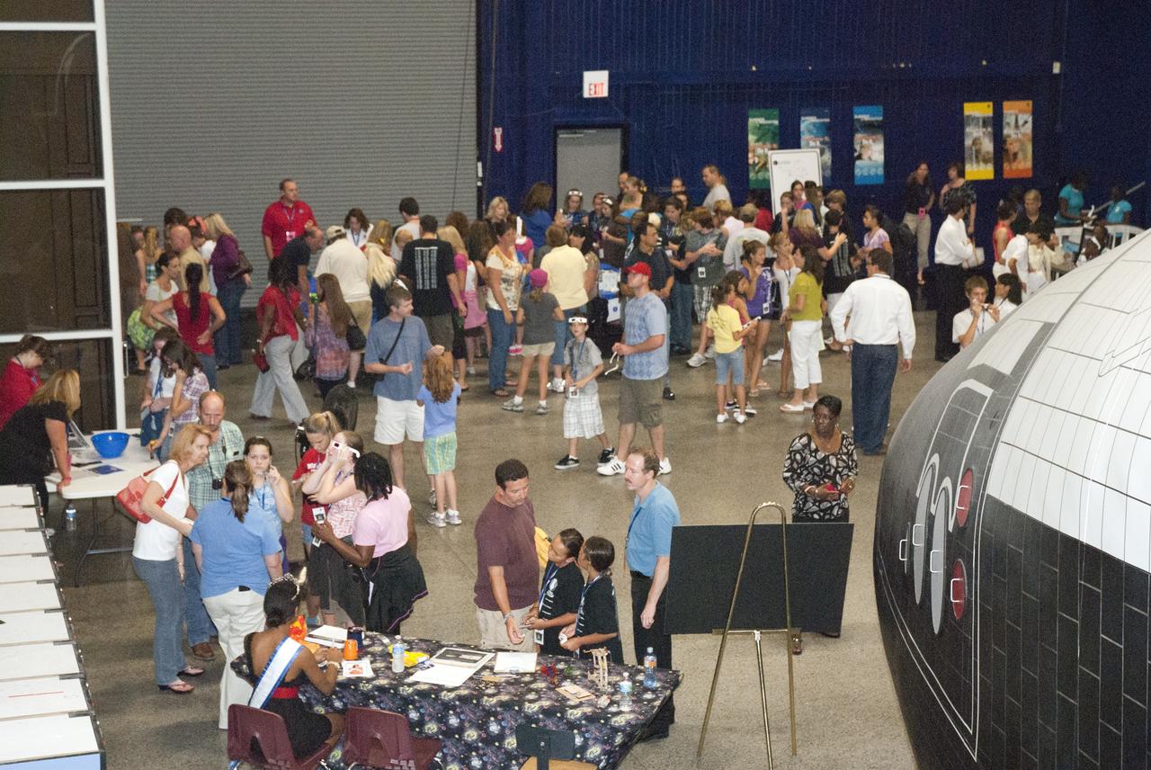 CAPE CANAVERAL, Fla. -- At the Astronaut Hall of Fame near the Kennedy Space Center Visitor Complex in Florida, fifth- through eighth-grade students and their parents participate in the last NASA family education night event. Activities included "gee-whiz" presentations, astronaut appearances, a hovercraft, vortex cannon and alternative fuel vehicles, which promote science, technology, engineering and mathematics (STEM) education.    The event is part of NASA's Summer of Innovation initiative to provide interactive learning experiences to middle school students nationwide during the summer months. The program is a cornerstone of the Educate to Innovate campaign announced by President Barack Obama in November 2009. Photo credit: NASA/Charisse Nahser