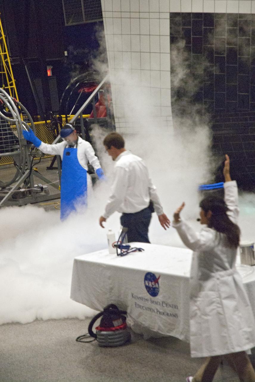 CAPE CANAVERAL, Fla. -- At the Astronaut Hall of Fame near the Kennedy Space Center Visitor Complex in Florida, fifth- through eighth-grade students and their parents watch a liquid nitrogen experiment during the last NASA family education night event. Other activities included "gee-whiz" presentations, astronaut appearances, a hovercraft, vortex cannon and alternative fuel vehicles, which promote science, technology, engineering and mathematics (STEM) education.    The event is part of NASA's Summer of Innovation initiative to provide interactive learning experiences to middle school students nationwide during the summer months. The program is a cornerstone of the Educate to Innovate campaign announced by President Barack Obama in November 2009. Photo credit: NASA/Charisse Nahser