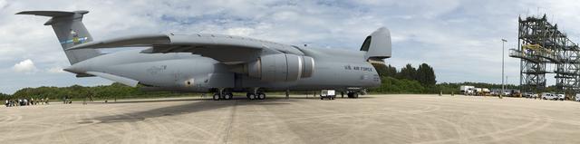 CAPE CANAVERAL, Fla. -- At NASA's Kennedy Space Center in Florida, media and workers watch as the Alpha Magnetic Spectrometer (AMS) is offloaded from an Air Force C-5M aircraft on the Shuttle Landing Facility runway. The state-of-the-art particle physics detector arrived at Kennedy from Europe and will operate as an external module on the International Space Station to study the universe and its origin by searching for dark matter. AMS will fly to the station aboard space shuttle Endeavour's STS-134 mission targeted to launch Feb. 26, 2011. Photo credit: NASA/Frankie Martin