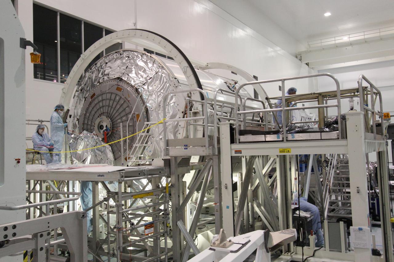 CAPE CANAVERAL, Fla. -- In the Space Station Processing Facility at NASA's Kennedy Space Center in Florida, technicians begin covering the hatch to the Permanent Multipurpose Module, or PMM, with insulating blankets to protect it and its contents from the harsh environment and temperatures of space. Space shuttle Discovery and its STS-133 crew are targeted to launch Nov. 1 and will deliver the PMM, packed with supplies and critical spare parts, as well as Robonaut 2, the dexterous humanoid astronaut helper, to the International Space Station. For more information visit: www.nasa.gov/shuttle. Photo credit: NASA/Jack Pfaller
