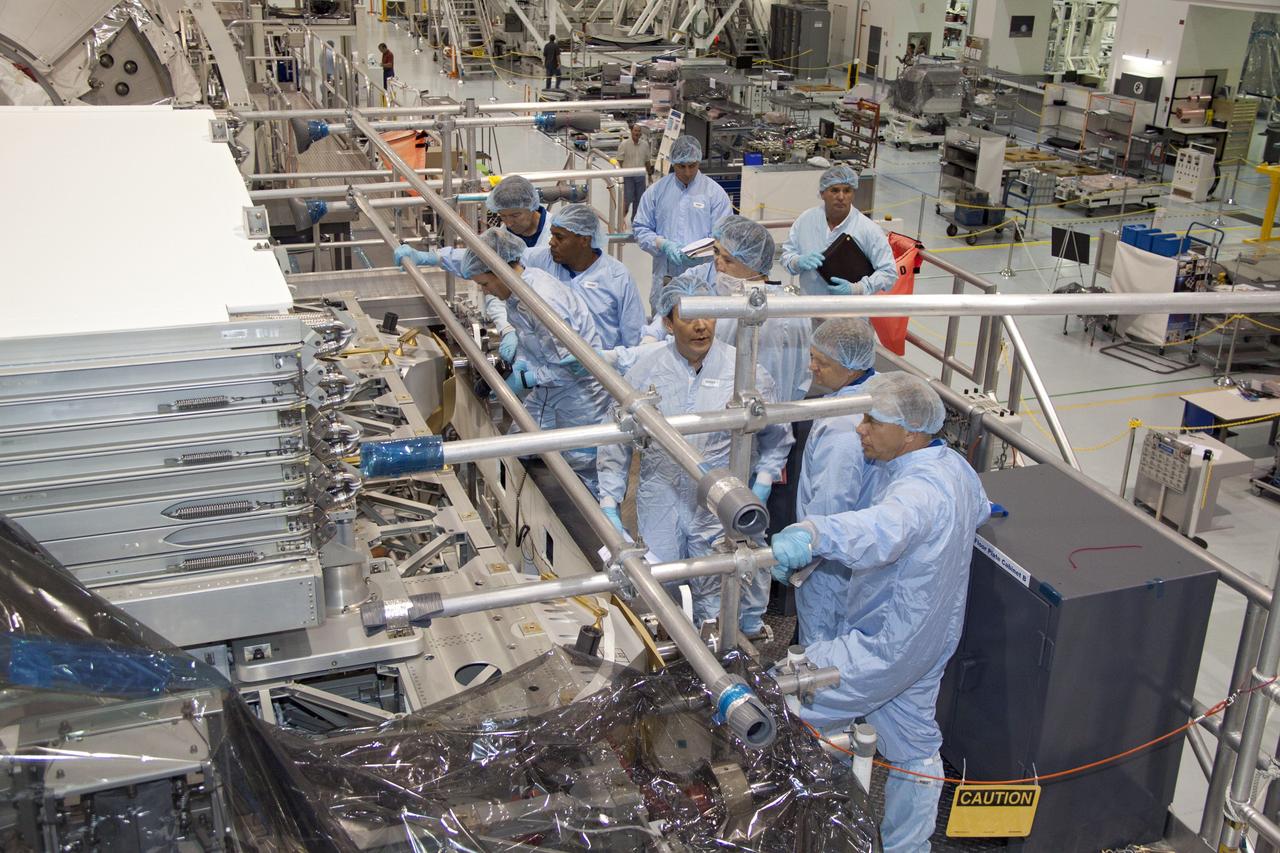 CAPE CANAVERAL, Fla. -- In the Space Station Processing Facility at NASA's Kennedy Space Center in Florida, the STS-133 crew members and processing technicians inspect the Express Logistics Carrier-3, or ELC-3. The astronauts are at Kennedy to participate in the Payload Crew Equipment Interface Test, or CEIT, which gives the crew an opportunity for hands-on training with tools they'll be using in space and familiarization of the payload they will be delivering to the International Space Station. Launch of space shuttle Discovery is targeted for Nov. 1 at 4:40 p.m. EDT. For more information visit, www.nasa.gov/shuttle. Photo credit: NASA/Jack Pfaller