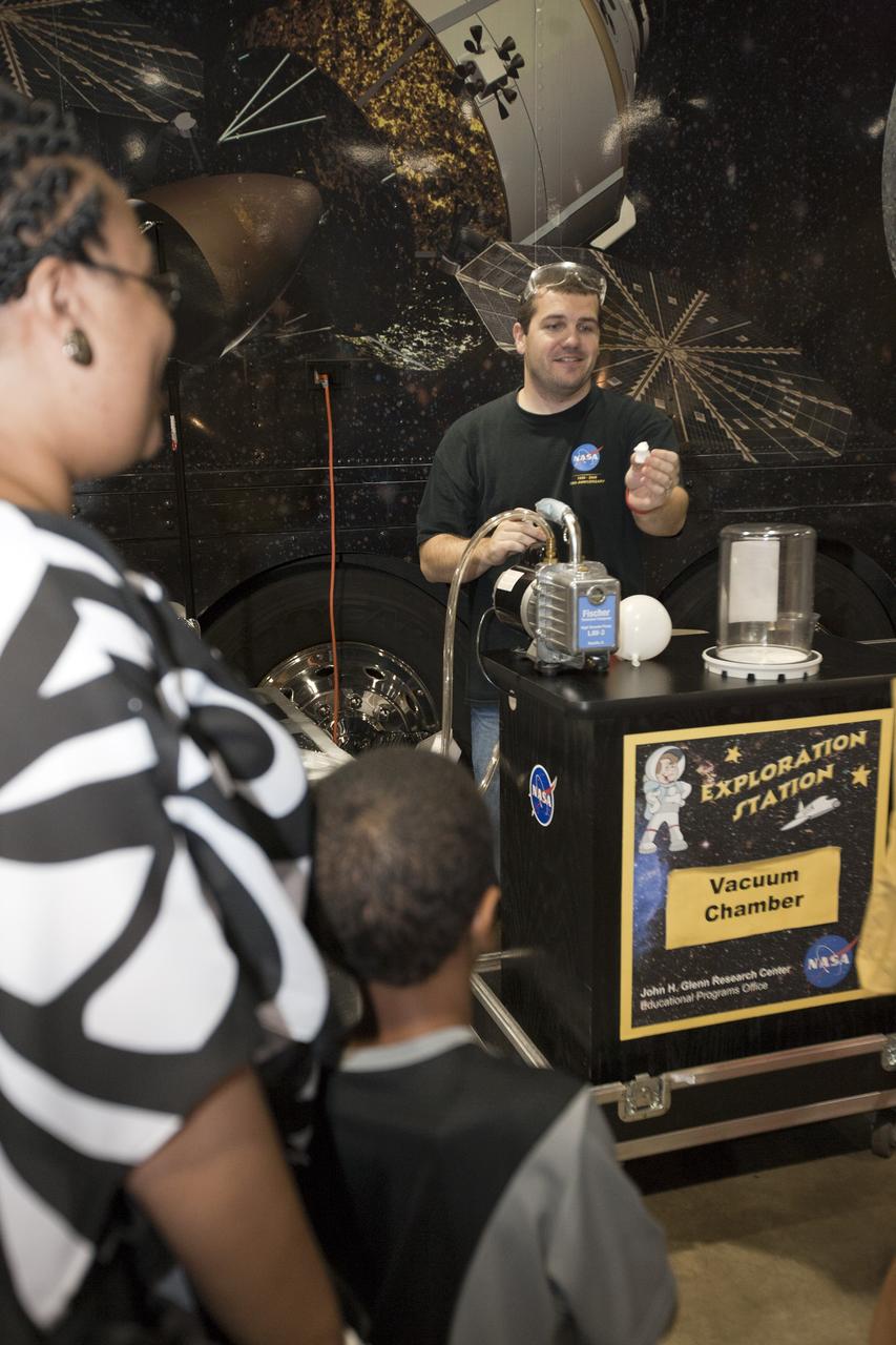 ORLANDO, Fla. -- Attendees of the 2010 Tom Joyner Family Reunion learn about packing food for space from NASA education specialist Chris Hartenstine at the Gaylord Palms Convention Center in Orlando, Fla.  To encourage student attendees to focus on pursuing careers in science, technology, engineering and mathematics (STEM), NASA featured some of its greatest legends and trailblazers during a panel discussion at the reunion event.    NASA's Education Office sponsored the panel discussion and educational activities as part of the agency's "Summer of Innovation" initiative and the federal "Educate to Innovate" campaign. Photo credit: NASA/Amanda Diller