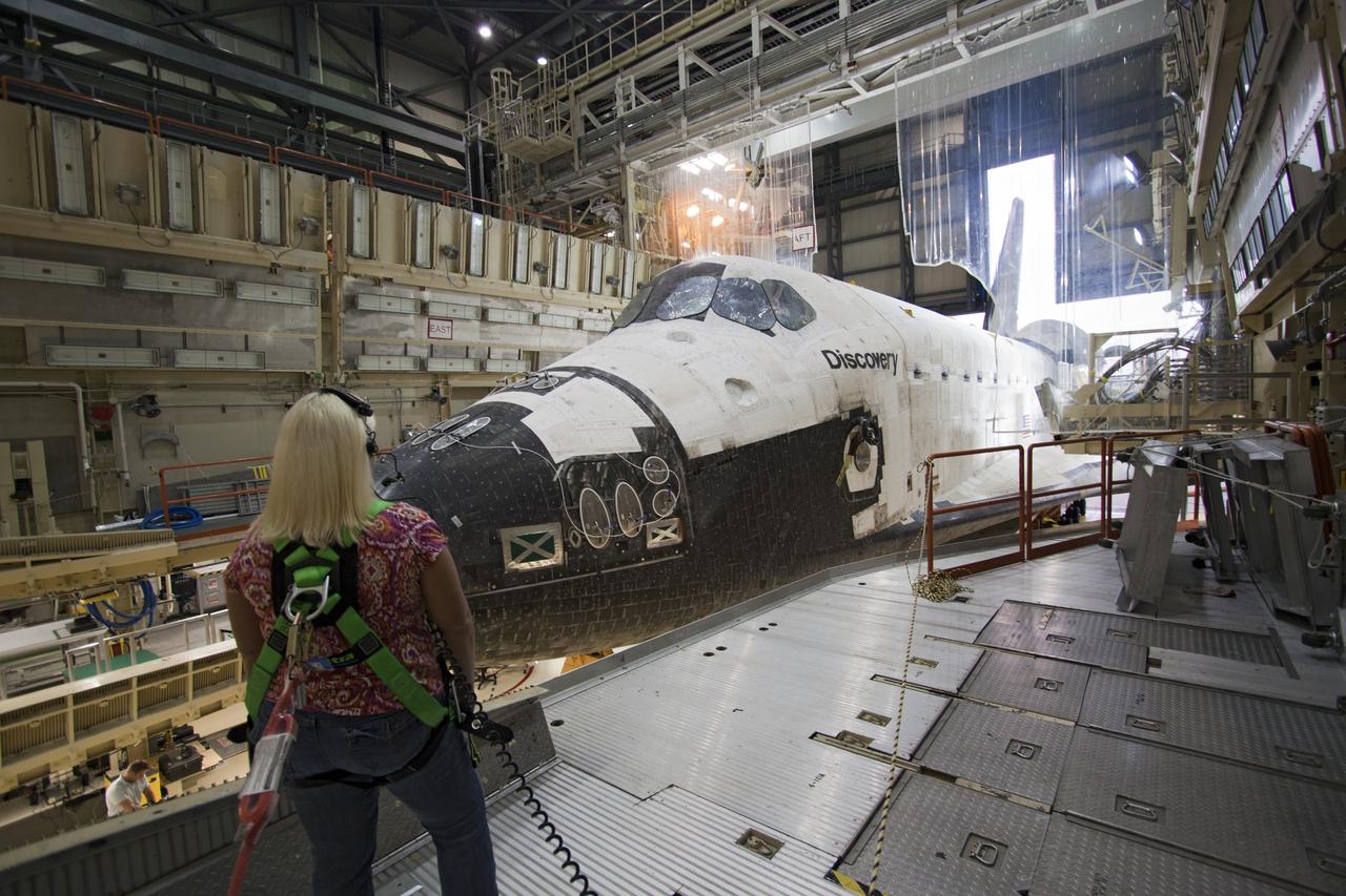 CAPE CANAVERAL, Fla. -- At NASA's Kennedy Space Center in Florida, shuttle Discovery begins to back out of Orbiter Processing Facility-3 during a move called "rollover" to the nearby Vehicle Assembly Building (VAB). Once inside the VAB, the shuttle will be joined to its solid rocket boosters and external fuel tank. Later this month, Discovery is scheduled to "rollout" to Launch Pad 39A for its launch to the International Space Station on the STS-133 mission. Targeted to liftoff Nov. 1, Discovery will take the Permanent Multipurpose Module (PMM) packed with supplies and critical spare parts, as well as Robonaut 2 (R2) to the station. Photo credit: NASA/Jack Pfaller
