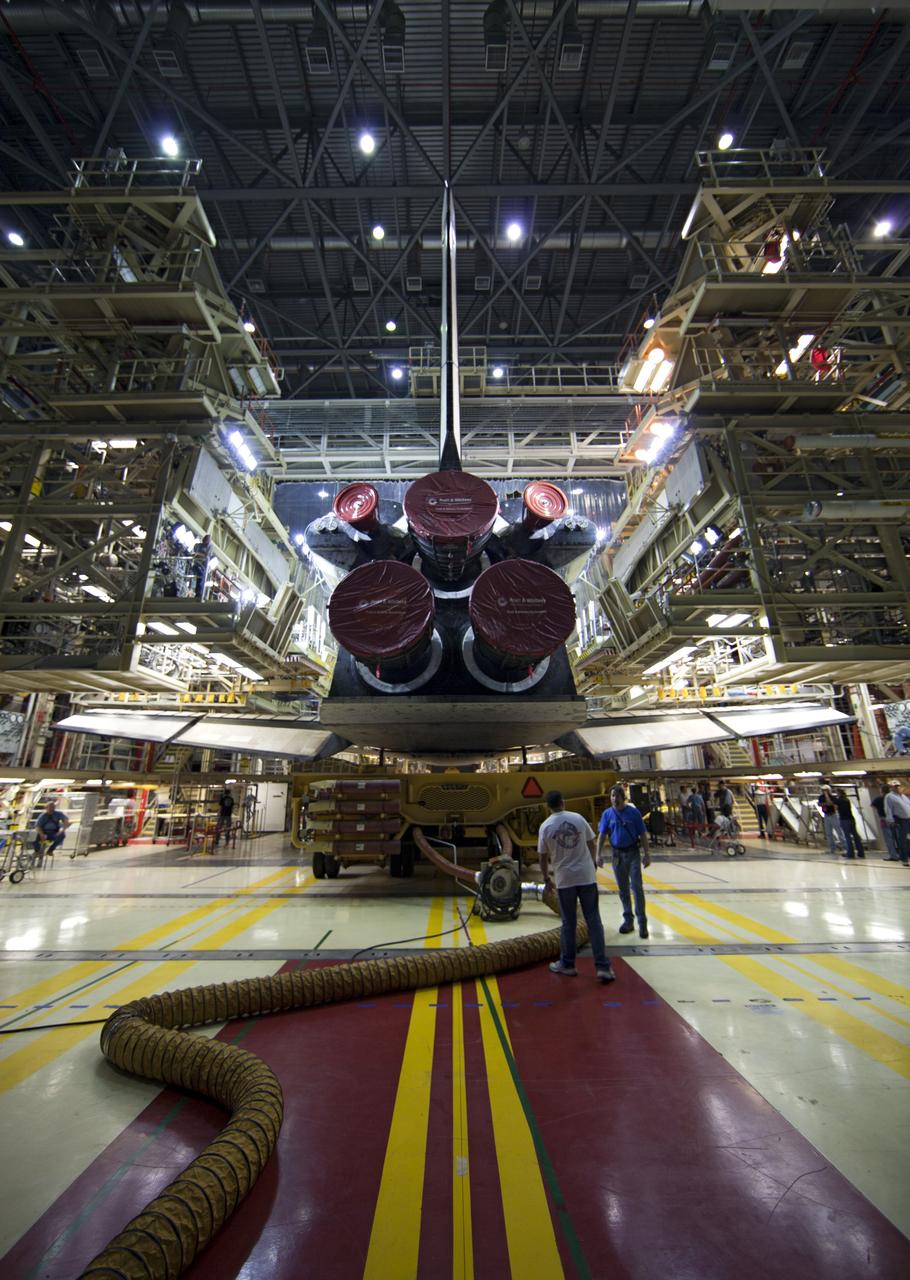 CAPE CANAVERAL, Fla. -- At NASA's Kennedy Space Center in Florida, shuttle Discovery begins to back out of Orbiter Processing Facility-3 during a move called "rollover" to the nearby Vehicle Assembly Building (VAB). Once inside the VAB, the shuttle will be joined to its solid rocket boosters and external fuel tank. Later this month, Discovery is scheduled to "rollout" to Launch Pad 39A for its launch to the International Space Station on the STS-133 mission.    Targeted to liftoff Nov. 1, Discovery will take the Permanent Multipurpose Module (PMM) packed with supplies and critical spare parts, as well as Robonaut 2 (R2) to the station. Photo credit: NASA/Dimitri Gerondidakis