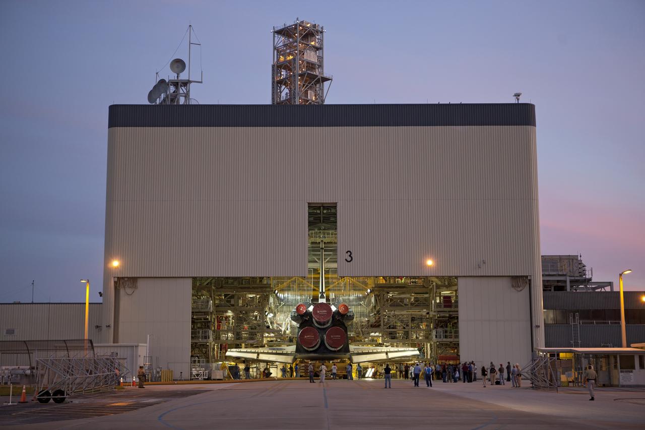 CAPE CANAVERAL, Fla. -- At NASA's Kennedy Space Center in Florida, shuttle Discovery backs out of Orbiter Processing Facility-3 during a move called "rollover" to the nearby Vehicle Assembly Building (VAB). Once inside the VAB, the shuttle will be joined to its solid rocket boosters and external fuel tank. Later this month, Discovery is scheduled to "rollout" to Launch Pad 39A for its launch to the International Space Station on the STS-133 mission.    Targeted to liftoff Nov. 1, Discovery will take the Permanent Multipurpose Module (PMM) packed with supplies and critical spare parts, as well as Robonaut 2 (R2) to the station. Photo credit: NASA/Dimitri Gerondidakis