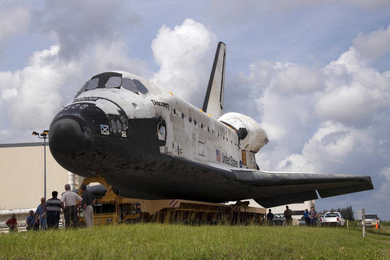 CAPE CANAVERAL, Fla. -- At NASA's Kennedy Space Center in Florida, shuttle Discovery continues its move, known as "rollover," from Orbiter Processing Facility-3 to the nearby Vehicle Assembly Building (VAB). Once inside the VAB, the shuttle will be joined to its solid rocket boosters and external fuel tank. Later this month, Discovery is scheduled to "rollout" to Launch Pad 39A for its launch to the International Space Station on the STS-133 mission. Targeted to liftoff Nov. 1, Discovery will take the Permanent Multipurpose Module (PMM) packed with supplies and critical spare parts, as well as Robonaut 2 (R2) to the station. Photo credit: NASA/Jack Pfaller