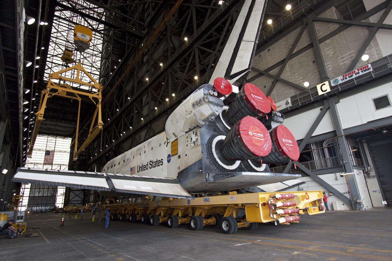 CAPE CANAVERAL, Fla. -- At NASA's Kennedy Space Center in Florida, shuttle Discovery is ushered into the Vehicle Assembly Building (VAB) from Orbiter Processing Facility-3 during a move known as "rollover." Once inside the VAB, the shuttle will be joined to its solid rocket boosters and external fuel tank. Later this month, Discovery is scheduled to "rollout" to Launch Pad 39A for its launch to the International Space Station on the STS-133 mission. Targeted to liftoff Nov. 1, Discovery will take the Permanent Multipurpose Module (PMM) packed with supplies and critical spare parts, as well as Robonaut 2 (R2) to the station. Photo credit: NASA/Jack Pfaller