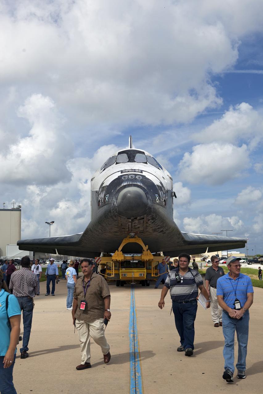 CAPE CANAVERAL, Fla. -- At NASA's Kennedy Space Center in Florida, shuttle Discovery pauses for photos during its move called "rollover" from Orbiter Processing Facility-3 to the nearby Vehicle Assembly Building (VAB). Once inside the VAB, the shuttle will be joined to its solid rocket boosters and external fuel tank. Later this month, Discovery is scheduled to "rollout" to Launch Pad 39A for its launch to the International Space Station on the STS-133 mission. Targeted to liftoff Nov. 1, Discovery will take the Permanent Multipurpose Module (PMM) packed with supplies and critical spare parts, as well as Robonaut 2 (R2) to the station. Photo credit: NASA/ Dimitri Gerondidakis