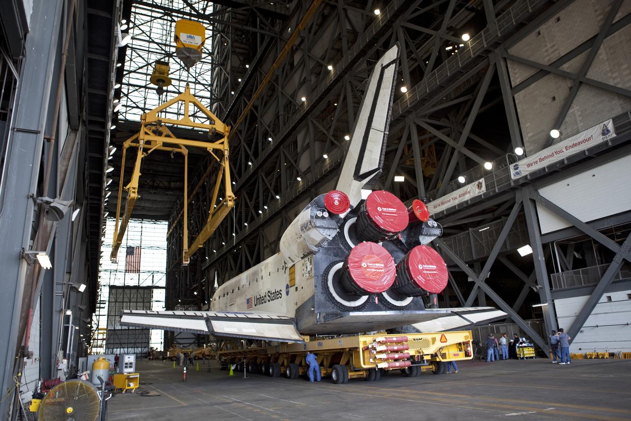 CAPE CANAVERAL, Fla. -- At NASA's Kennedy Space Center in Florida, shuttle Discovery is ushered into the Vehicle Assembly Building (VAB) from Orbiter Processing Facility-3 during a move known as "rollover." The large, yellow and metal sling to the left of Discovery will hoist the spacecraft out of the VAB transfer aisle and then lower it to its external fuel tank and twin solid rocket boosters. Later this month, Discovery is scheduled to "rollout" to Launch Pad 39A for its launch to the International Space Station on the STS-133 mission. Targeted to liftoff Nov. 1, Discovery will take the Permanent Multipurpose Module (PMM) packed with supplies and critical spare parts, as well as Robonaut 2 (R2) to the station. Photo credit: NASA/ Dimitri Gerondidakis