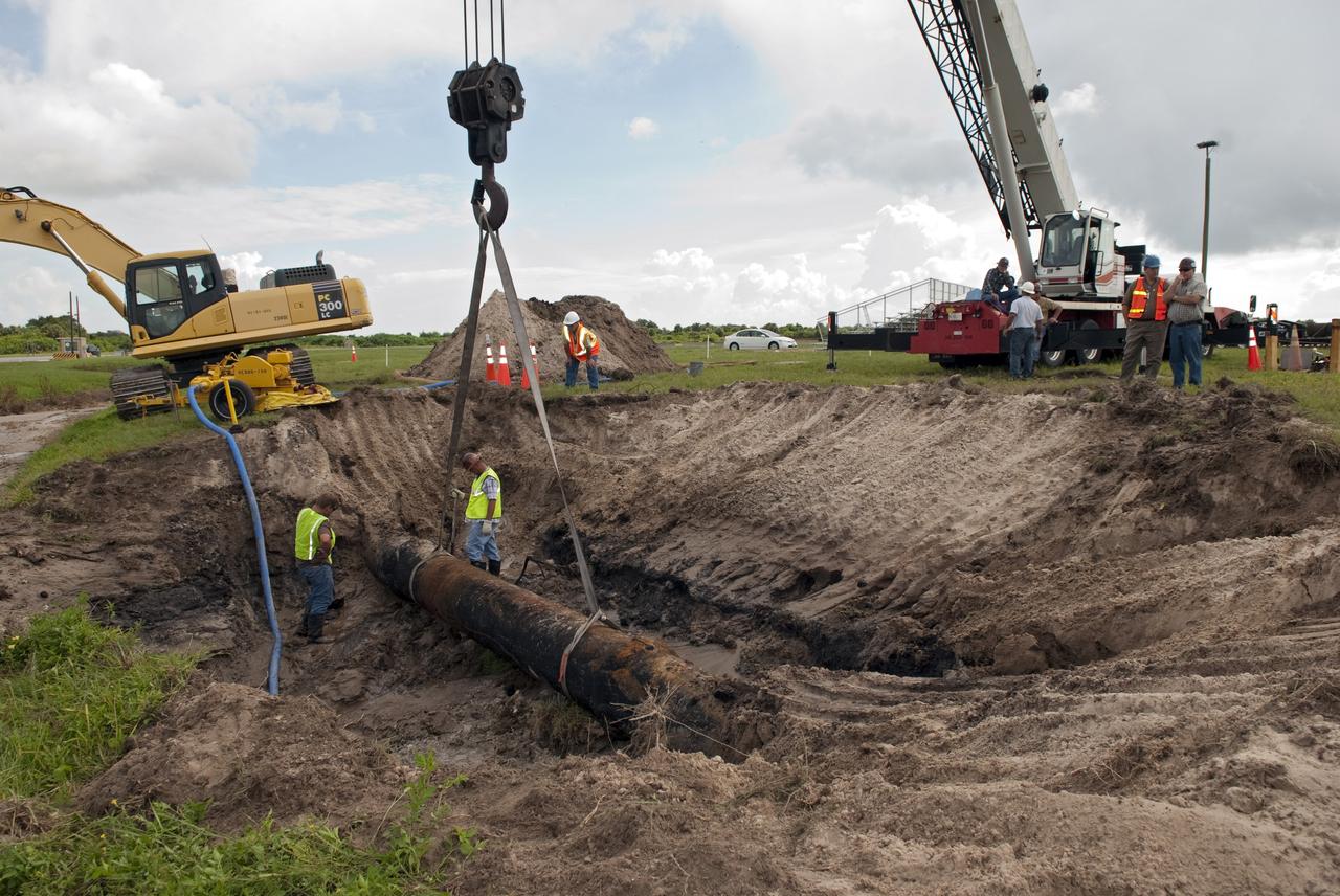 CAPE CANAVERAL, Fla. -- At NASA's Kennedy Space Center in Florida, a crew begins to fix a major water main break in a 24-inch cast iron pipe in the Launch Complex-39 Turn Basin area, across from the Vehicle Assembly Building and the Launch Control Center. Kennedy was closed to non-essential personnel the morning of Sept. 8 while crews assessed the break and restored water to the center. Photo credit: NASA/Jim Grossmann