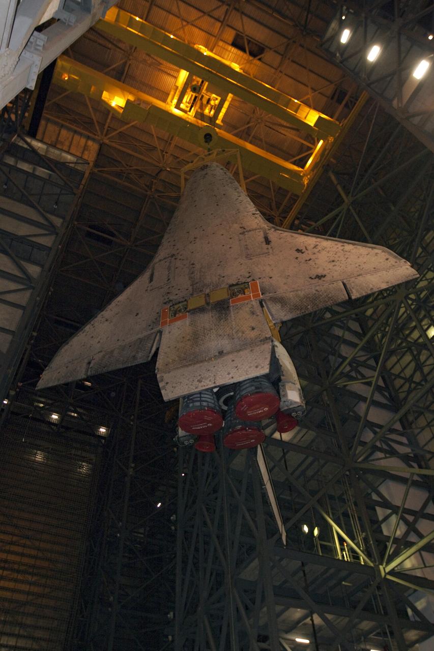 CAPE CANAVERAL, Fla. -- At NASA's Kennedy Space Center in Florida, a large yellow, metal sling lifts shuttle Discovery from the transfer aisle into High Bay 3 of the Vehicle Assembly Building. In the bay, the shuttle will be attached to its external fuel tank and solid rocket boosters. The operation began Sept. 9 and wrapped up early Sept. 10. Discovery is scheduled to roll out to Launch Pad 39A later this month in preparation for its launch to the International Space Station on the STS-133 mission. Targeted to lift off Nov. 1, Discovery will take the Permanent Multipurpose Module (PMM) packed with supplies and critical spare parts, as well as Robonaut 2 (R2) to the station. Photo credit: NASA/Jack Pfaller
