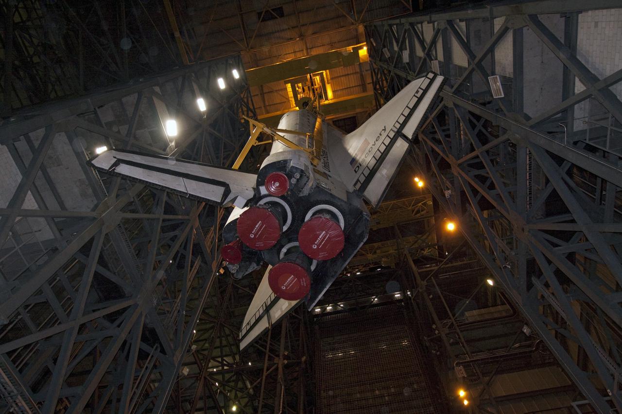 CAPE CANAVERAL, Fla. -- At NASA's Kennedy Space Center in Florida, a large yellow, metal sling lifts shuttle Discovery from the transfer aisle into High Bay 3 of the Vehicle Assembly Building. In the bay, the shuttle will be attached to its external fuel tank and solid rocket boosters. The operation began Sept. 9 and wrapped up early Sept. 10. Discovery is scheduled to roll out to Launch Pad 39A later this month in preparation for its launch to the International Space Station on the STS-133 mission. Targeted to lift off Nov. 1, Discovery will take the Permanent Multipurpose Module (PMM) packed with supplies and critical spare parts, as well as Robonaut 2 (R2) to the station. Photo credit: NASA/Jack Pfaller