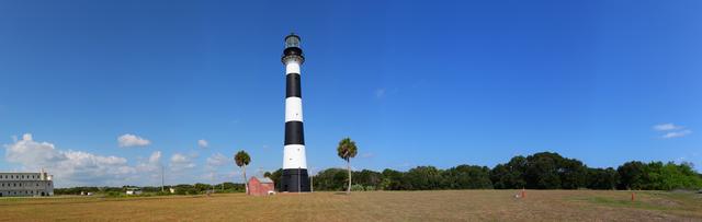 CAPE CANAVERAL, Fla. --The Cape Canaveral Lighthouse stands in the midst of space-age structures, a monolith born in another era of exploration. Located near Launch Complex-36 on Cape Canaveral Air Force Station, the Coast Guard transferred ownership in 2000 of the lighthouse structure and its grounds to the U.S. Air Force. A restoration of the lighthouse was completed by the Air Force in 2007. The Coast Guard continues to maintain the beacon as an active navigational aid. The Cape Canaveral Lighthouse Foundation supports the Air Force with activities associated with the lighthouse. For its history, visit www.nasa.gov/centers/kennedy/about/history/lighthouse.html or canaverallight.org. Photo credit: Frankie Martin