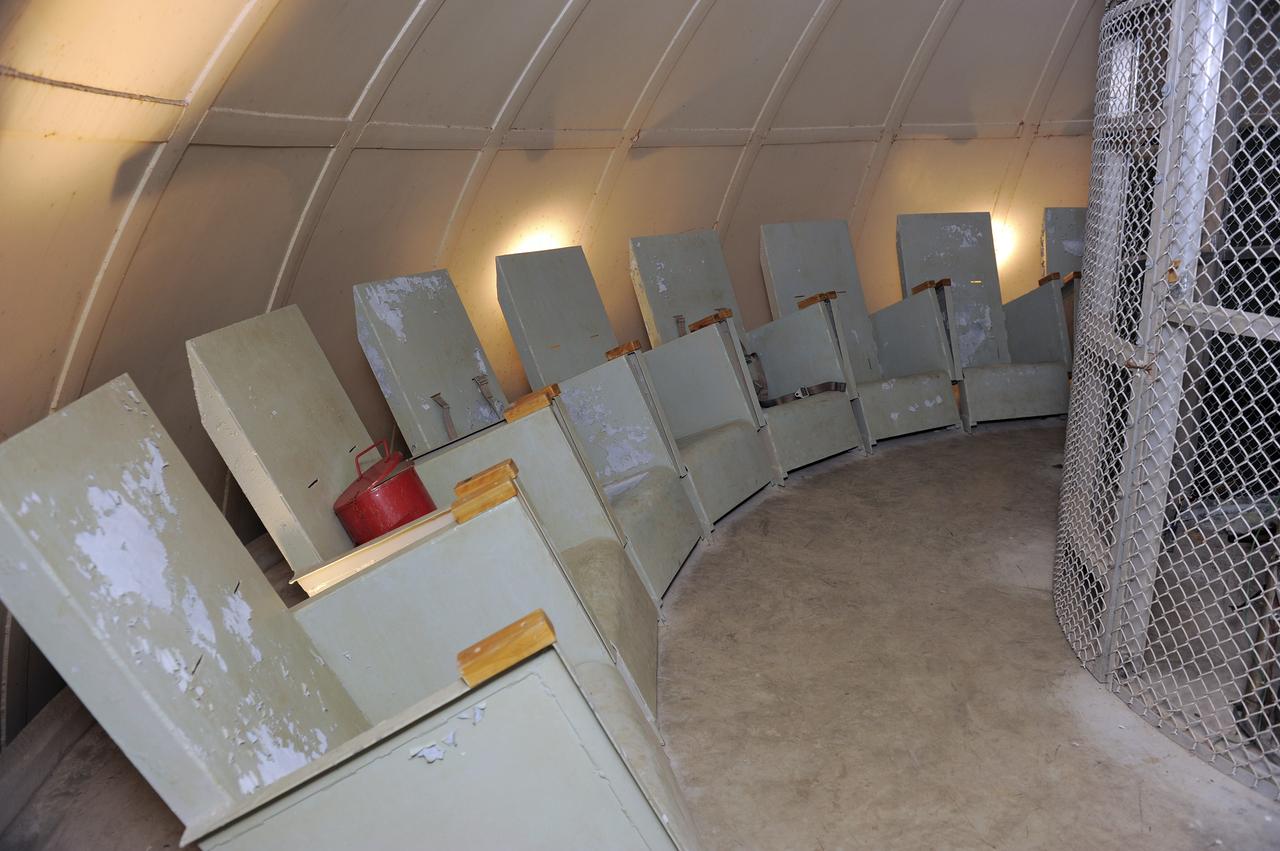 CAPE CANAVERAL, Fla. -- Twenty contour chairs line the blast-resistant "rubber room" beneath Launch Pad 39B at NASA's Kennedy Space Center in Florida. The room is a steel dome floating on rubber isolators and was used as an escape route during the Apollo Program in case of an emergency. It has since been abandoned by astronauts, but throughout the years nature found its way inside, including raccoons, snakes, birds and even a bobcat and opossum.    Starting in 2009, the structure above the room on the pad was no longer needed for NASA's Space Shuttle Program, so it is being restructured for future use. The new design will feature a "clean pad" for rockets to come with their own launcher, making it more versatile for a number of vehicles. For information on NASA's future plans, visit www.nasa.gov. Photo credit: NASA/Kim Shiflett