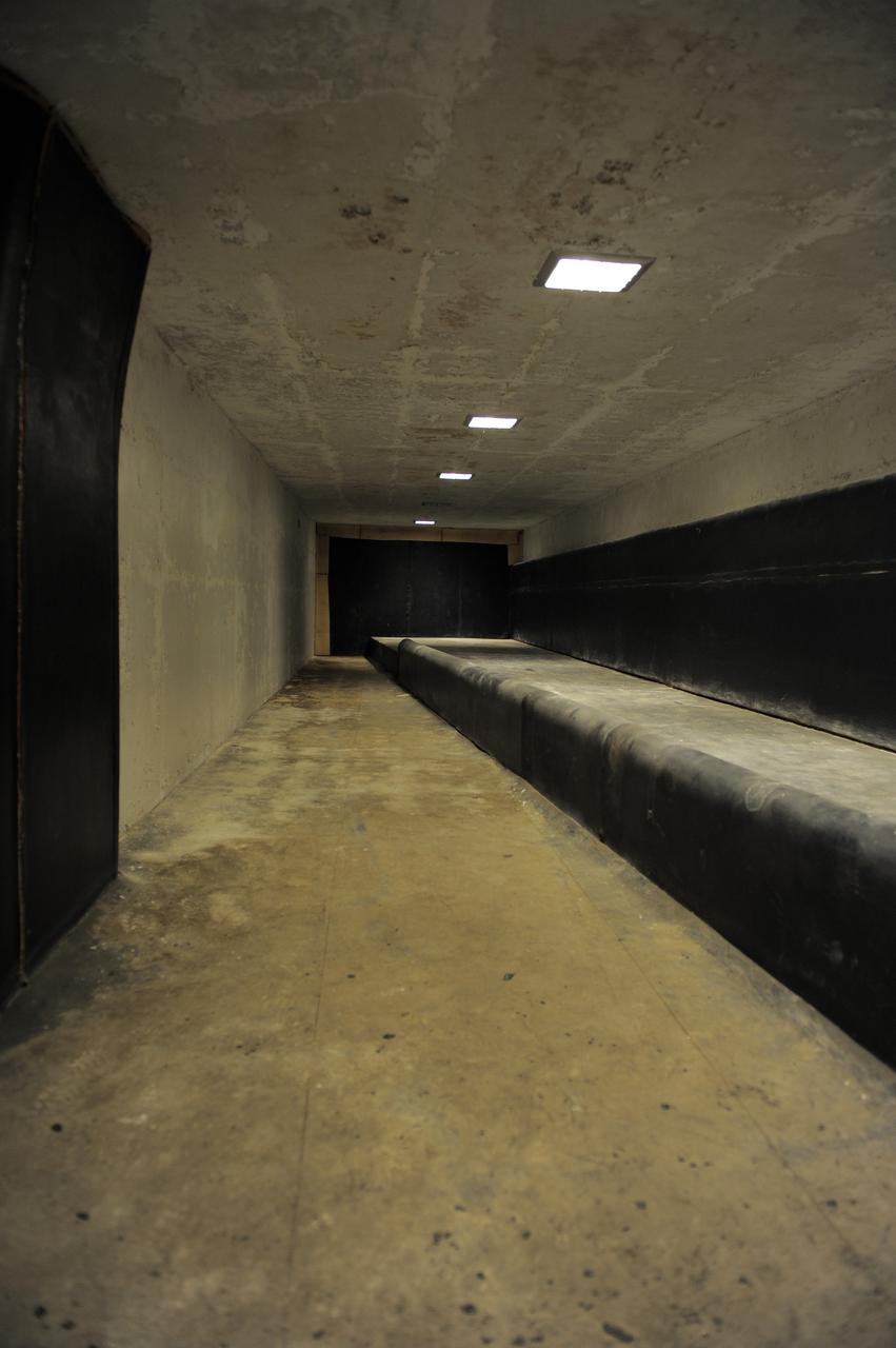CAPE CANAVERAL, Fla. -- A tunnel beneath Launch Pad 39B at NASA's Kennedy Space Center in Florida leads to the blast-resistant "rubber room." The room is a steel dome floating on rubber isolators and was used as an escape route during the Apollo Program in case of an emergency. It has since been abandoned by astronauts, but throughout the years nature found its way inside, including raccoons, snakes, birds and even a bobcat and opossum.    Starting in 2009, the structure above the room on the pad was no longer needed for NASA's Space Shuttle Program, so it is being restructured for future use. The new design will feature a "clean pad" for rockets to come with their own launcher, making it more versatile for a number of vehicles. For information on NASA's future plans, visit www.nasa.gov. Photo credit: NASA/Kim Shiflett