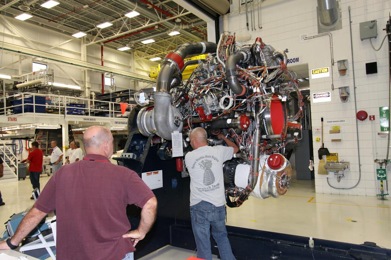 CAPE CANAVERAL, Fla. -- In the Space Shuttle Main Engine Processing Facility at NASA's Kennedy Space Center in Florida, one of six space shuttle main engines is prepared for the STS-134 and STS-335 missions. Postflight inspections and maintenance of each engine are conducted in the facility between shuttle missions by Pratt & Whitney Rocketdyne aerospace technicians. Three main engines are clustered at the aft end of the shuttle and have a combined thrust of more than 1.2 million pounds. Each engine utilizes liquid hydrogen for fuel and liquid oxygen as oxidizer and operates during the entire eight-and-a-half minute ride to orbit.    Space shuttle Endeavour's STS-134 mission is the final planned mission of the Space Shuttle Program and will deliver the Alpha Magnetic Spectrometer, as well as critical spare components, to the International Space Station next year. Shuttle Atlantis will be prepared for STS-335, which is the planned "launch on need," or potential rescue mission, for Endeavour's STS-134 mission. For information, visit www.nasa.gov/shuttle. Photo credit: NASA/Jack Pfaller