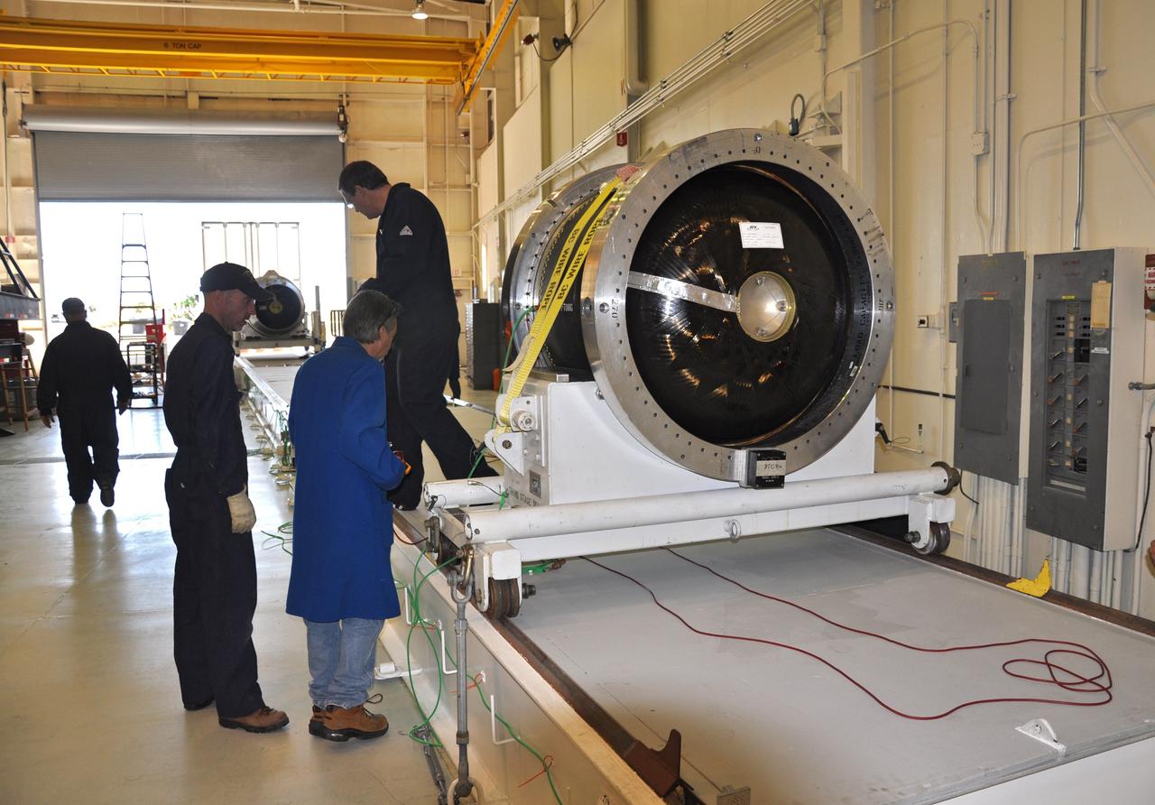 VANDENBERG AIR FORCE BASE, Calif. -- At Vandenberg Air Force Base in California, the second stage of the Pegasus XL rocket that will launch the Nuclear Spectroscopic Telescope Array (NuSTAR) to orbit is moved to a stationary rail in Building 1555 for processing. After the rocket and spacecraft are processed at Vandenberg, they will be shipped to the Ronald Reagan Ballistic Missile Defense Test Site located at the Pacific Ocean’s Kwajalein Atoll for launch.    The high-energy X-ray telescope will conduct a census for black holes, map radioactive material in young supernovae remnants, and study the origins of cosmic rays and the extreme physics around collapsed stars.  Photo credit: NASA/Randy Beaudoin, VAFB