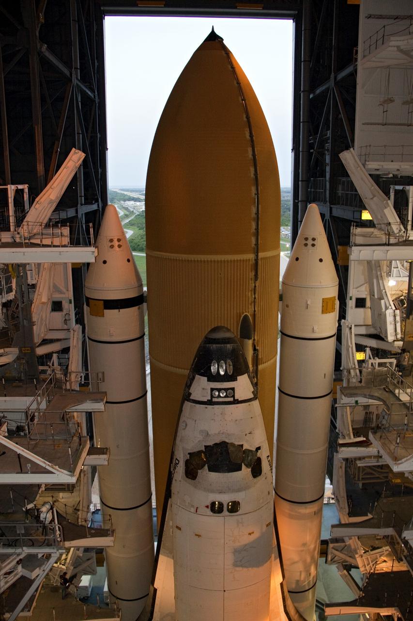 CAPE CANAVERAL, Fla. -- At NASA's Kennedy Space Center in Florida, space shuttle Discovery is ready for its nighttime trek, known as "rollout," from the Vehicle Assembly Building to Launch Pad 39A. It will take the shuttle, attached to its external fuel tank, twin solid rocket boosters and mobile launcher platform, about six hours to complete the move atop a crawler-transporter. Rollout sets the stage for Discovery's STS-133 crew to practice countdown and launch procedures during the Terminal Countdown Demonstration Test in mid-October. Targeted to liftoff Nov. 1, Discovery will take the Permanent Multipurpose Module (PMM) packed with supplies and critical spare parts, as well as Robonaut 2 (R2) to the International Space Station. Photo credit: NASA/Mic Miracle