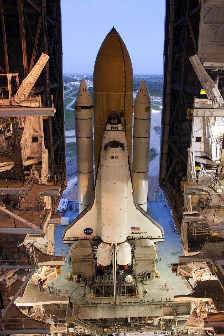 CAPE CANAVERAL, Fla. -- At NASA's Kennedy Space Center in Florida, space shuttle Discovery begins its nighttime trek, known as "rollout," from the Vehicle Assembly Building to Launch Pad 39A. It will take the shuttle, attached to its external fuel tank, twin solid rocket boosters and mobile launcher platform, about six hours to complete the move atop a crawler-transporter. Rollout sets the stage for Discovery's STS-133 crew to practice countdown and launch procedures during the Terminal Countdown Demonstration Test in mid-October. Targeted to liftoff Nov. 1, Discovery will take the Permanent Multipurpose Module (PMM) packed with supplies and critical spare parts, as well as Robonaut 2 (R2) to the International Space Station. Photo credit: NASA/Mic Miracle