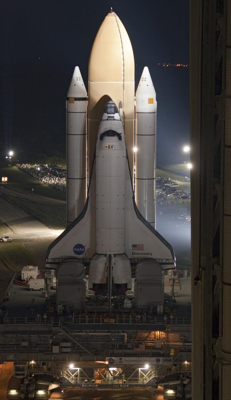 CAPE CANAVERAL, Fla. -- Bathed in bright xenon lights, space shuttle Discovery makes its nighttime trek, known as "rollout," from the Vehicle Assembly Building to Launch Pad 39A at NASA's Kennedy Space Center in Florida. It will take the shuttle, attached to its external fuel tank, twin solid rocket boosters and mobile launcher platform, about six hours to complete the move atop a crawler-transporter. Rollout sets the stage for Discovery's STS-133 crew to practice countdown and launch procedures during the Terminal Countdown Demonstration Test in mid-October. Targeted to liftoff Nov. 1, Discovery will take the Permanent Multipurpose Module (PMM) packed with supplies and critical spare parts, as well as Robonaut 2 (R2) to the International Space Station. Photo credit: NASA/Mic Miracle
