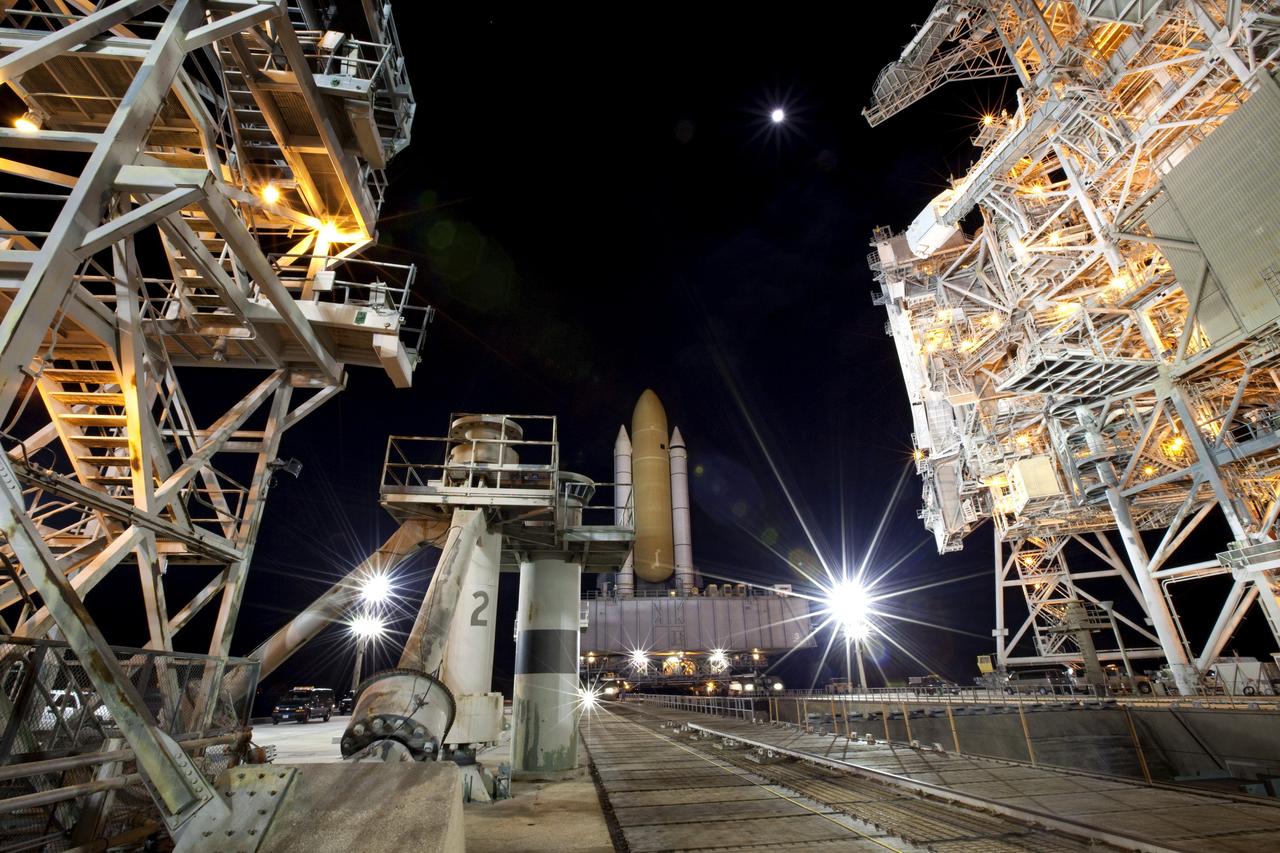 CAPE CANAVERAL, Fla. -- At NASA's Kennedy Space Center in Florida, space shuttle Discovery makes the last leg of its journey, known as "rollout," from the Vehicle Assembly Building to Launch Pad 39A. It took the shuttle, attached to its external fuel tank, twin solid rocket boosters and mobile launcher platform, about six hours to complete the move atop a crawler-transporter. Rollout sets the stage for Discovery's STS-133 crew to practice countdown and launch procedures during the Terminal Countdown Demonstration Test in mid-October. Targeted to liftoff Nov. 1, Discovery will take the Permanent Multipurpose Module (PMM) packed with supplies and critical spare parts, as well as Robonaut 2 (R2) to the International Space Station. Photo credit: NASA/Frankie Martin