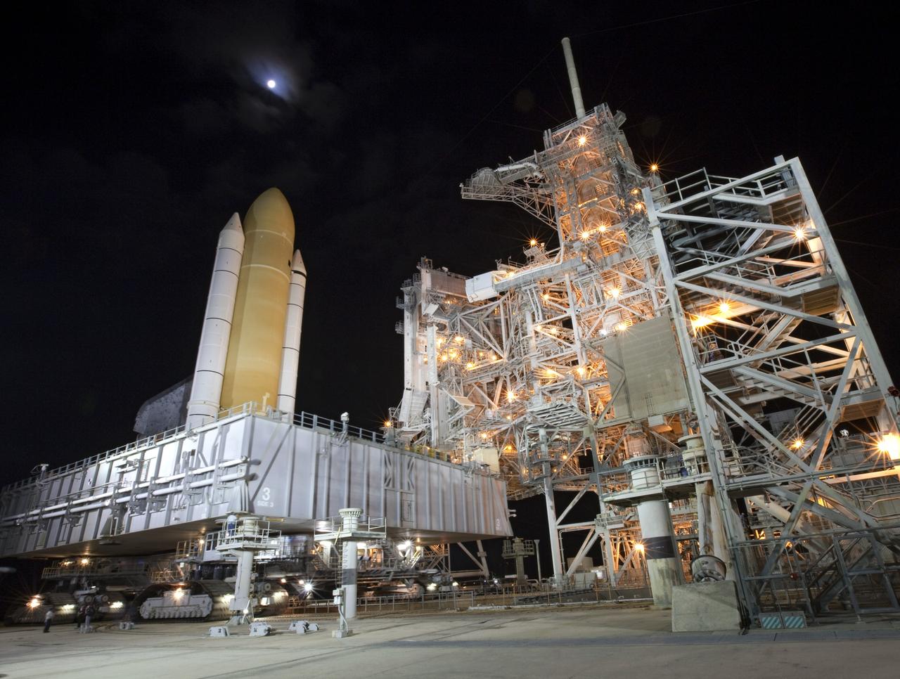 CAPE CANAVERAL, Fla. -- At NASA's Kennedy Space Center in Florida, space shuttle Discovery approaches Launch Pad 39A during "rollout" from the Vehicle Assembly Building to Launch Pad 39A. It took the shuttle, attached to its external fuel tank, twin solid rocket boosters and mobile launcher platform, about six hours to complete the move atop a crawler-transporter. Rollout sets the stage for Discovery's STS-133 crew to practice countdown and launch procedures during the Terminal Countdown Demonstration Test in mid-October. Targeted to liftoff Nov. 1, Discovery will take the Permanent Multipurpose Module (PMM) packed with supplies and critical spare parts, as well as Robonaut 2 (R2) to the International Space Station. Photo credit: NASA/Frankie Martin